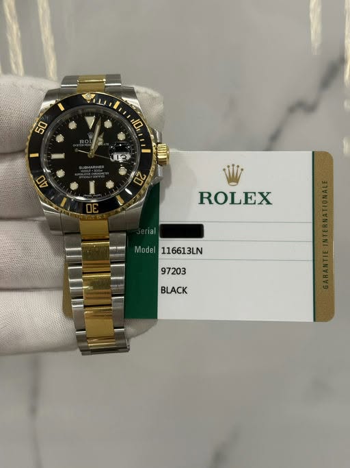 May be an image of wrist watch and text that says '50 10 2 ROLEX Mod Model 116613LN 97203'