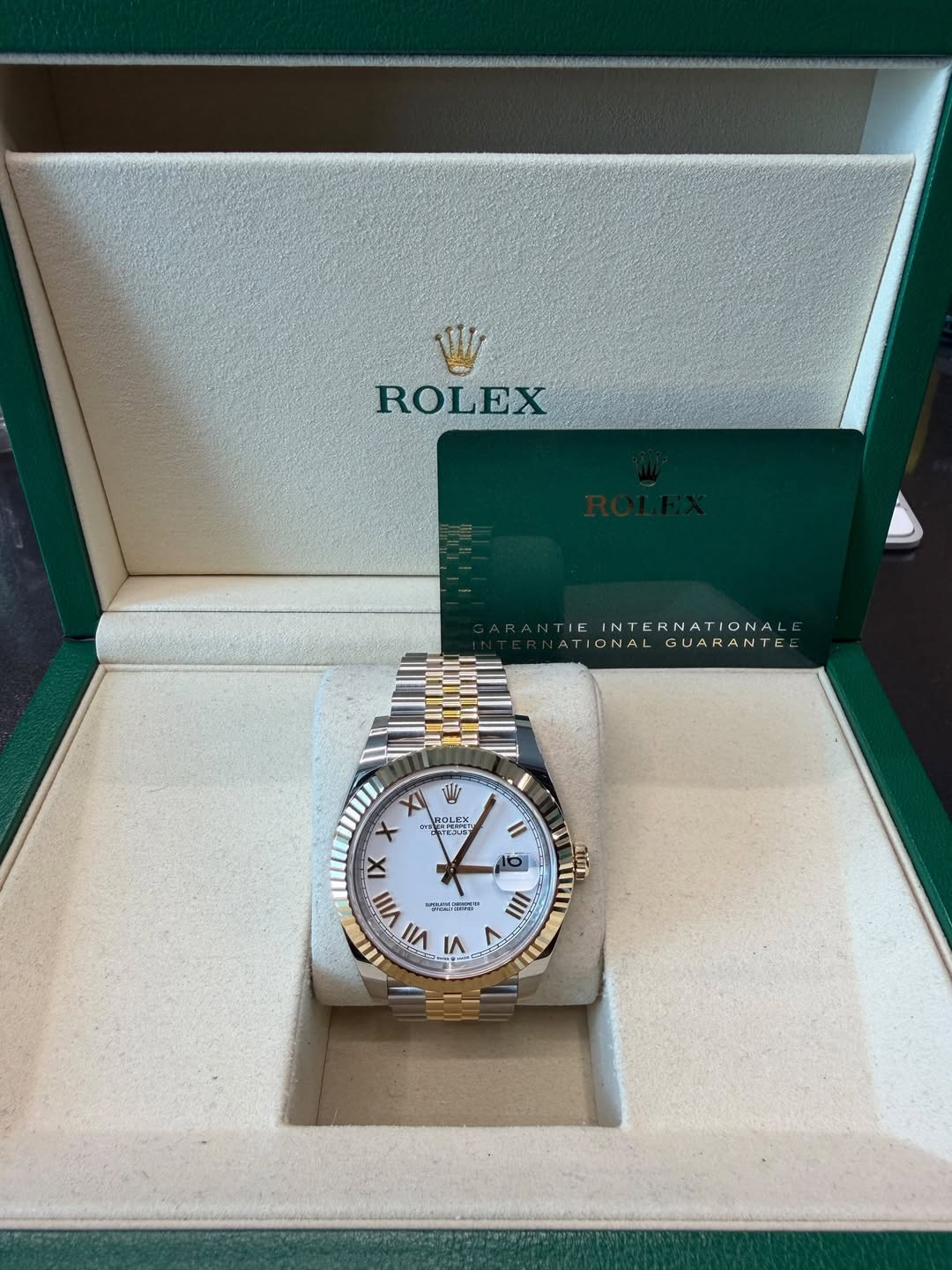 May be an image of wrist watch and text