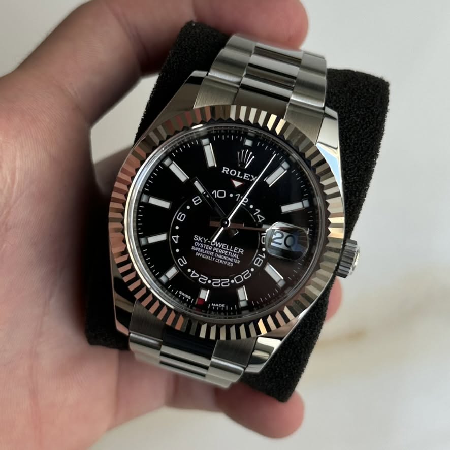 May be an image of wrist watch and text