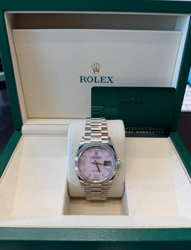 May be an image of wrist watch and text