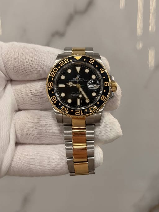 May be an image of wrist watch and text
