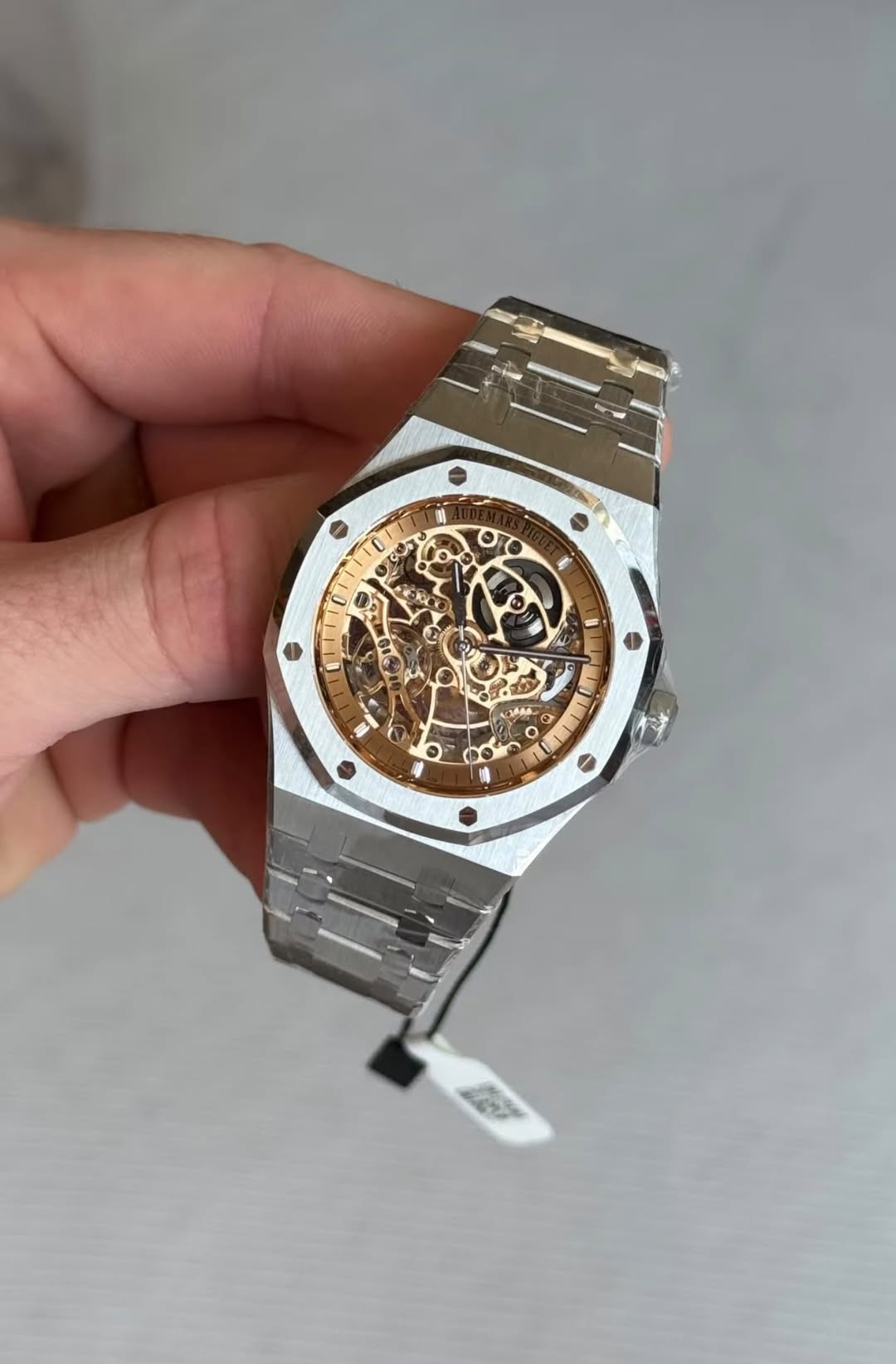 May be an image of wrist watch and text