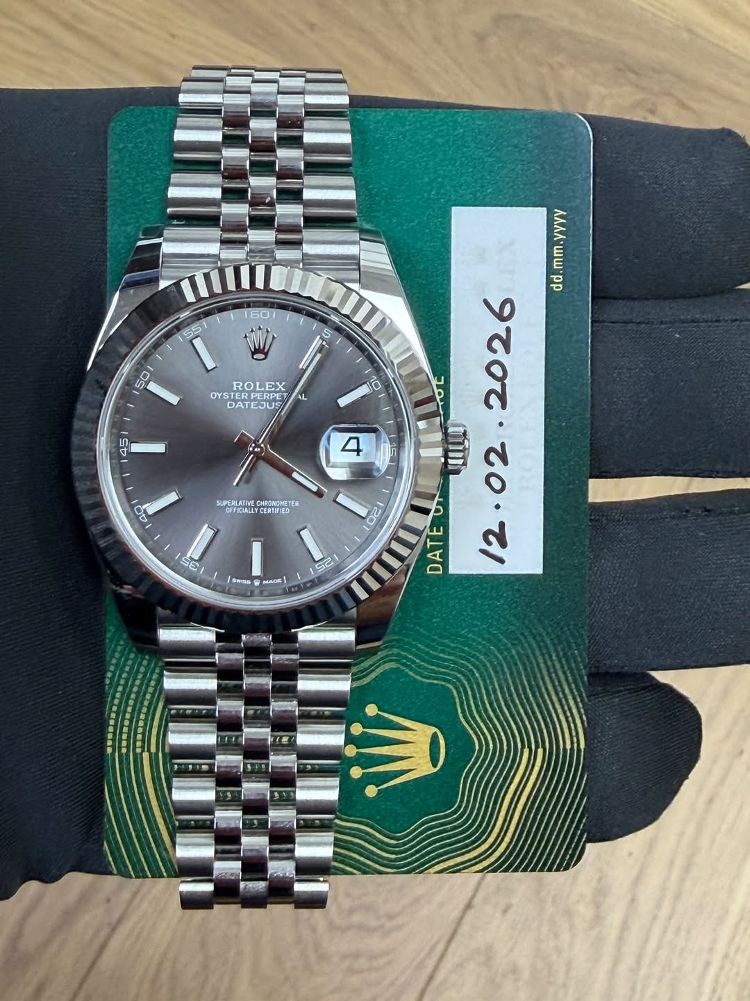 May be an image of wrist watch and text