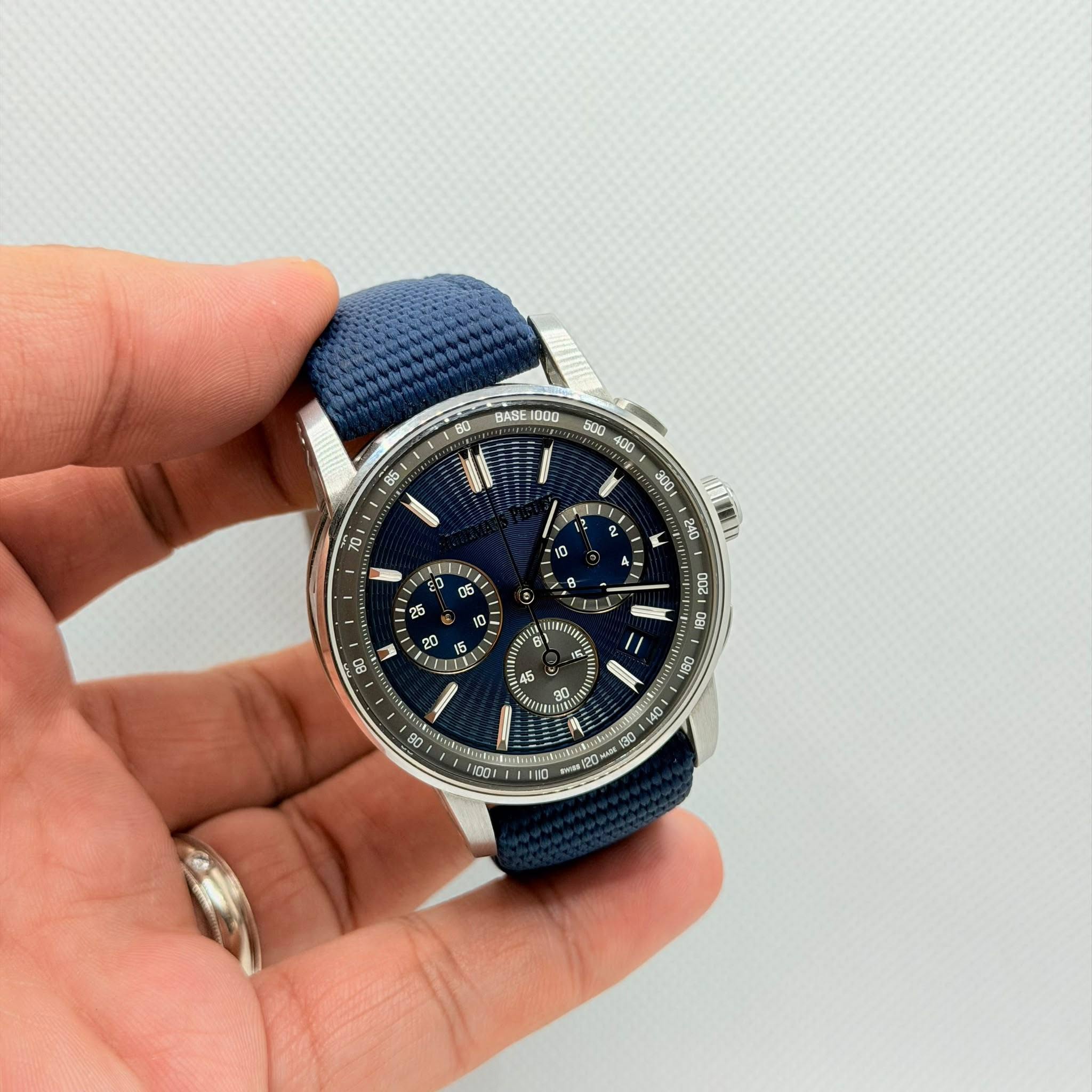 May be an image of wrist watch and text