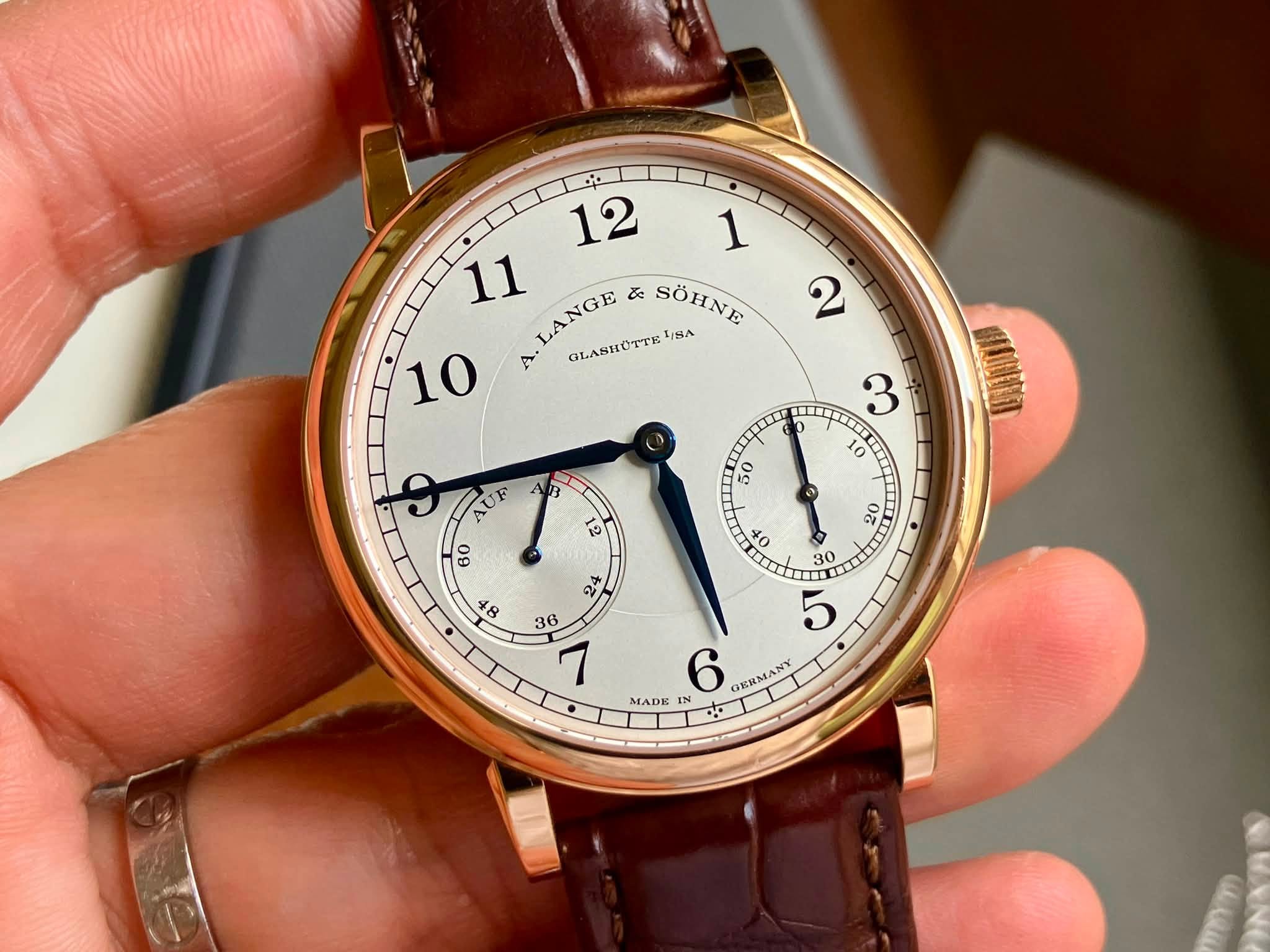 May be an image of wrist watch and text that says '12 1 11 LANGE ぶ SÖHNE 10 A. OKлR/ 티유스 ፍ ೧ 10 nτα 50 ه 60 1२ 20 O 40 0 o4 cι す ဆ 36 7 30 O ان 6 CRN RIMANY MADE IN'