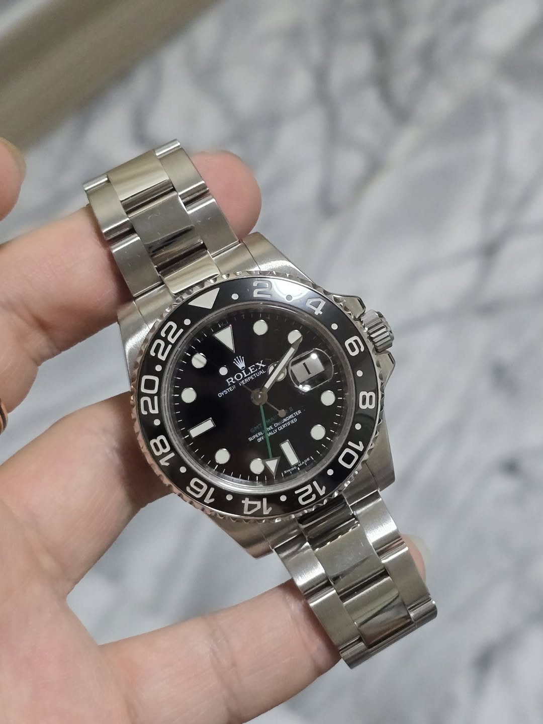 May be an image of wrist watch and text