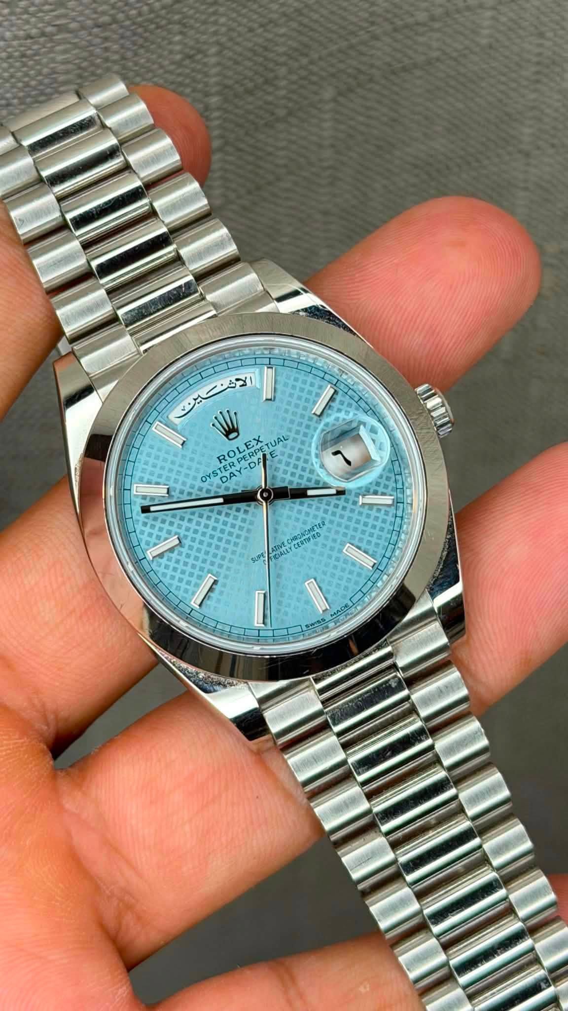 May be an image of wrist watch and text