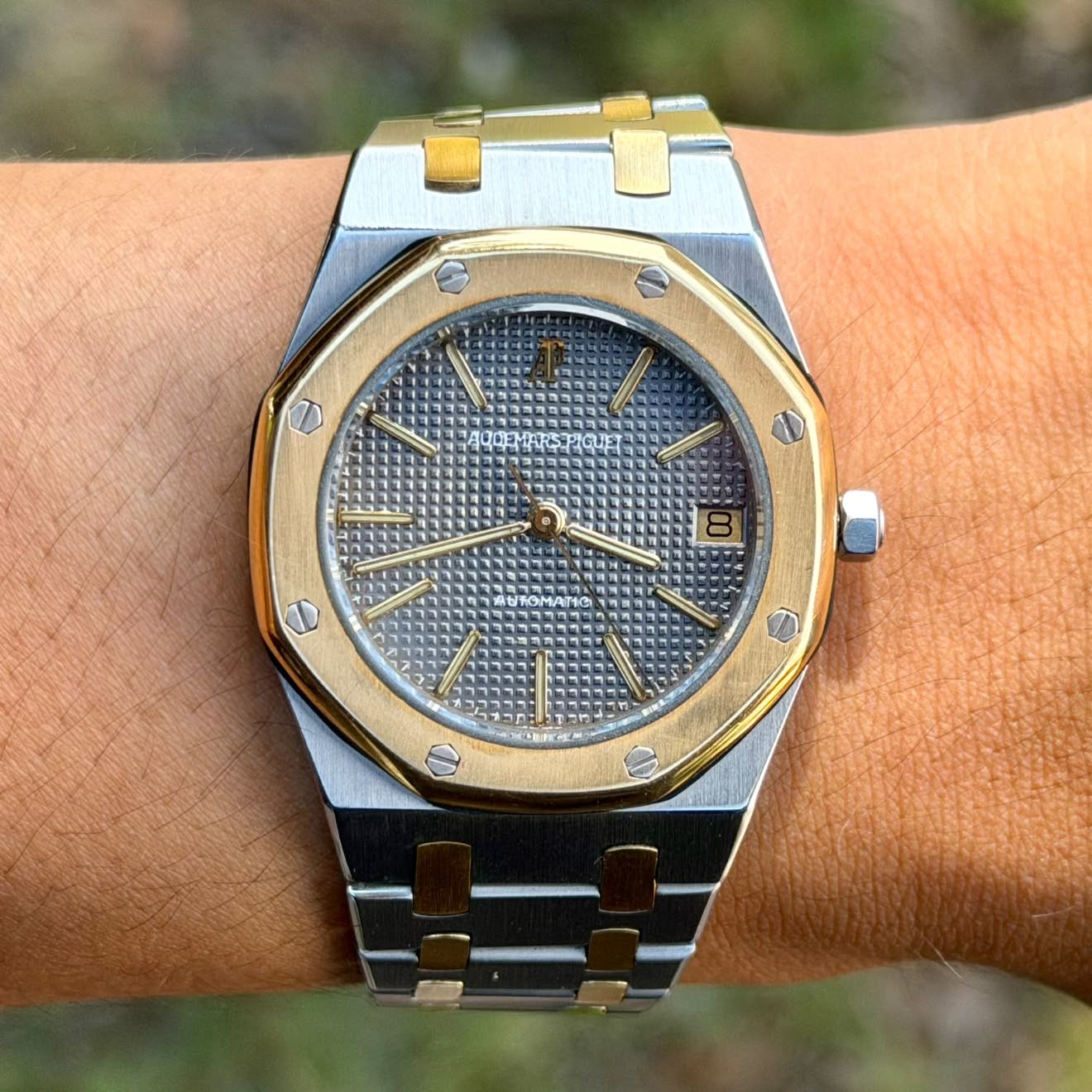 May be an image of wrist watch and text