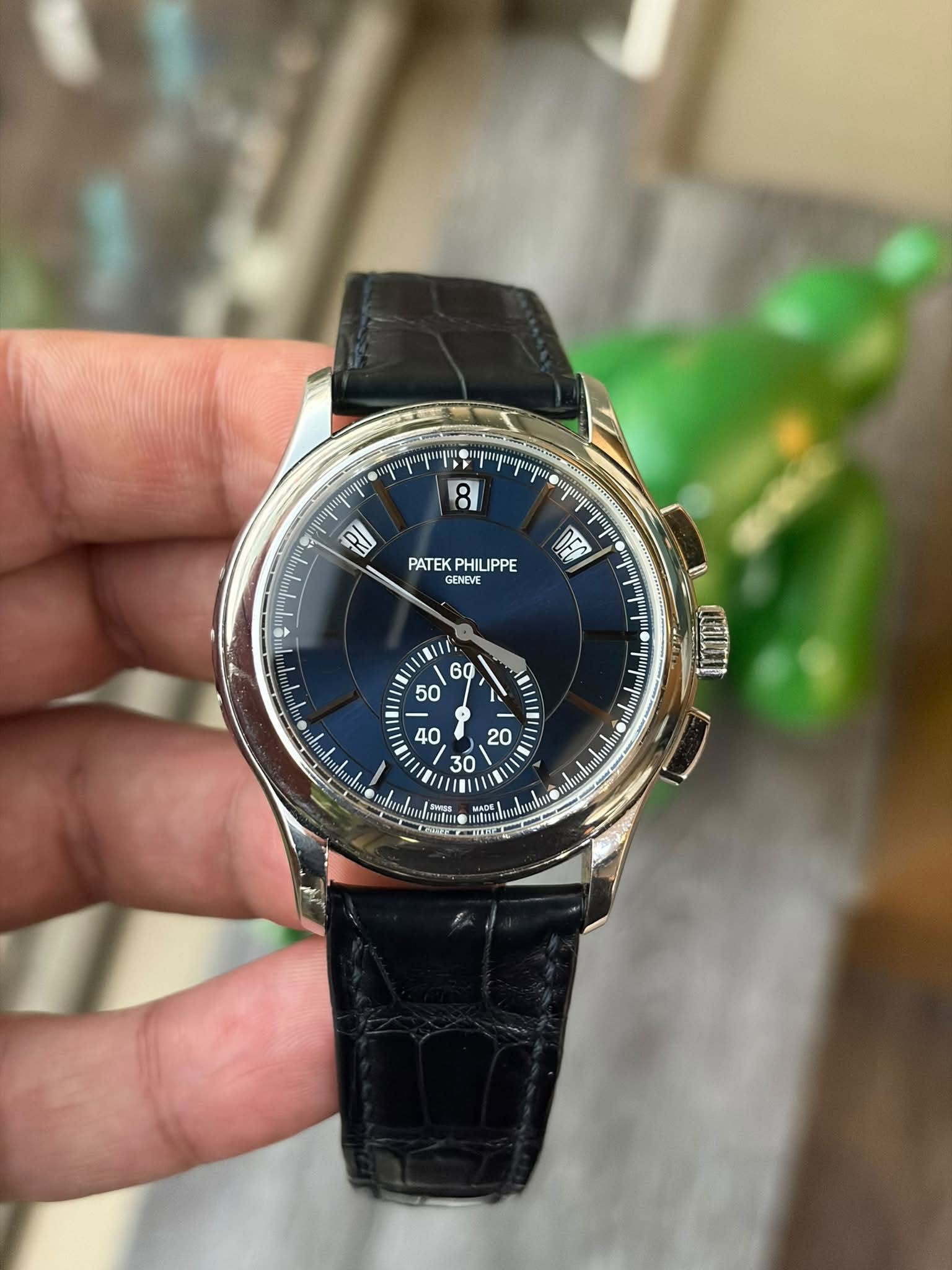 May be an image of wrist watch and text