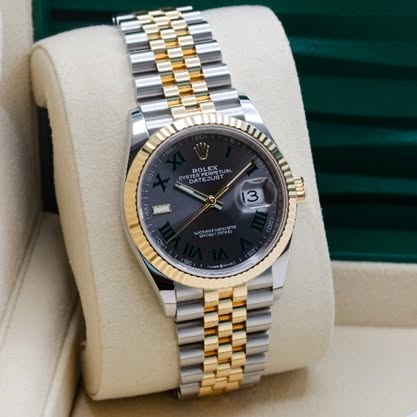 May be an image of wrist watch and text