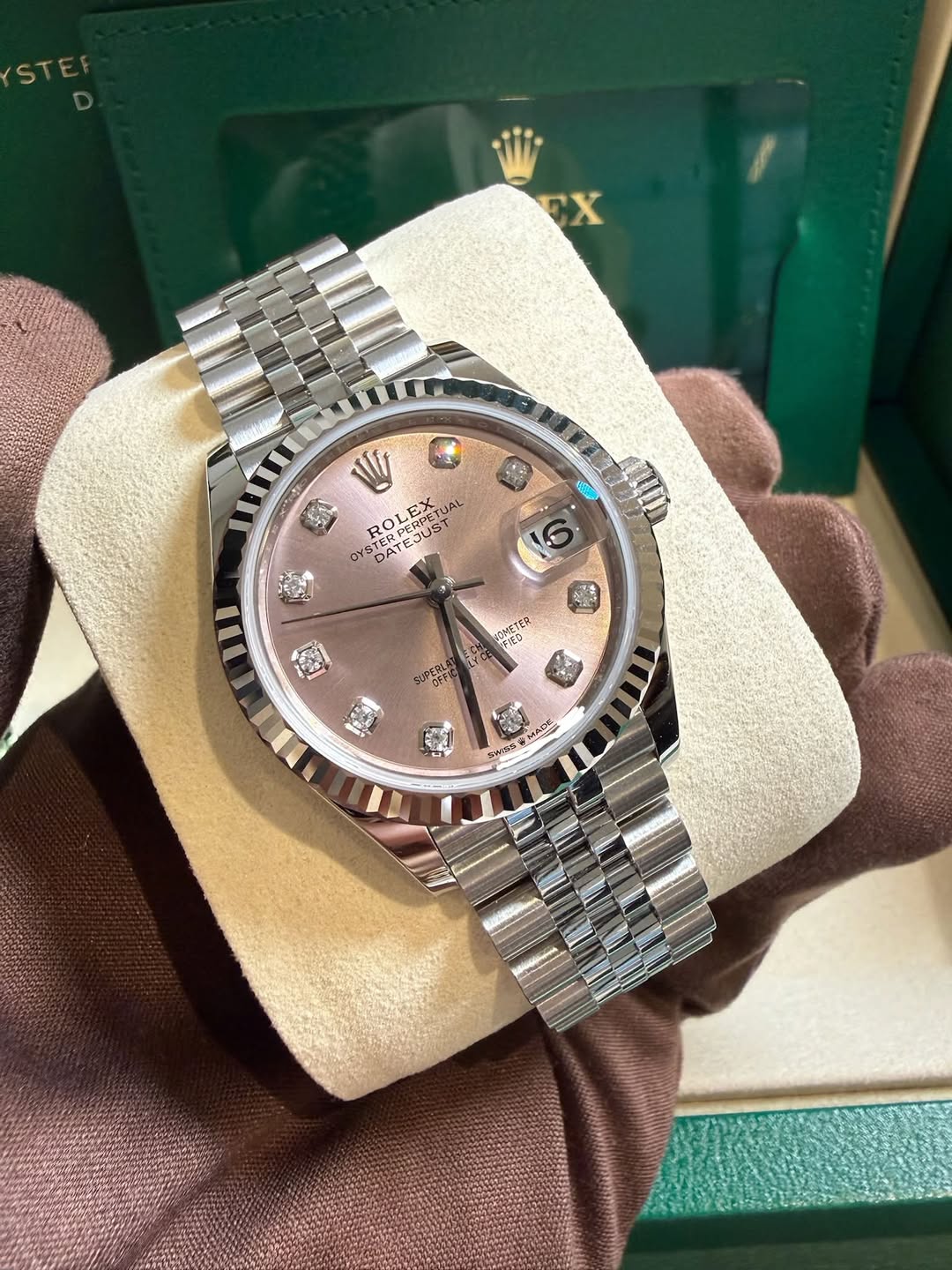 May be an image of wrist watch and text