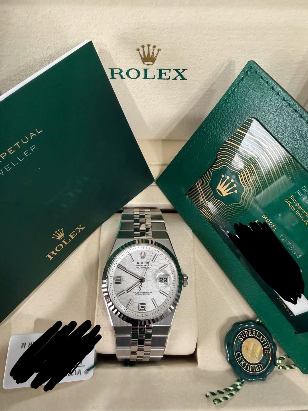 May be an image of wrist watch and text