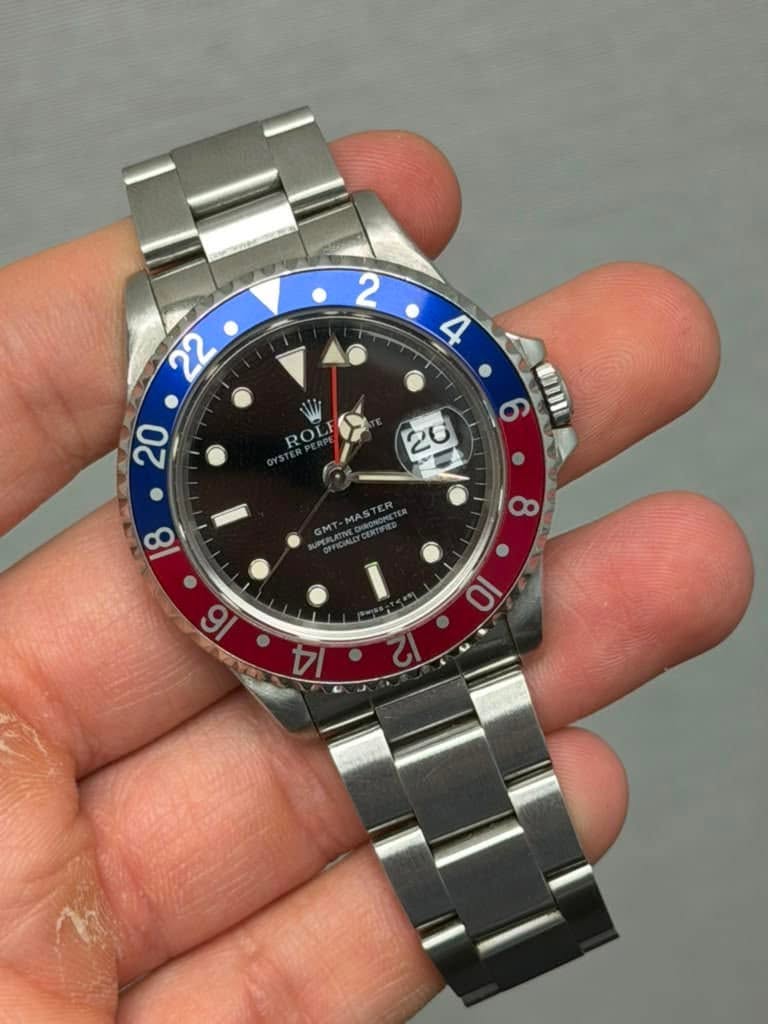 May be an image of wrist watch and text