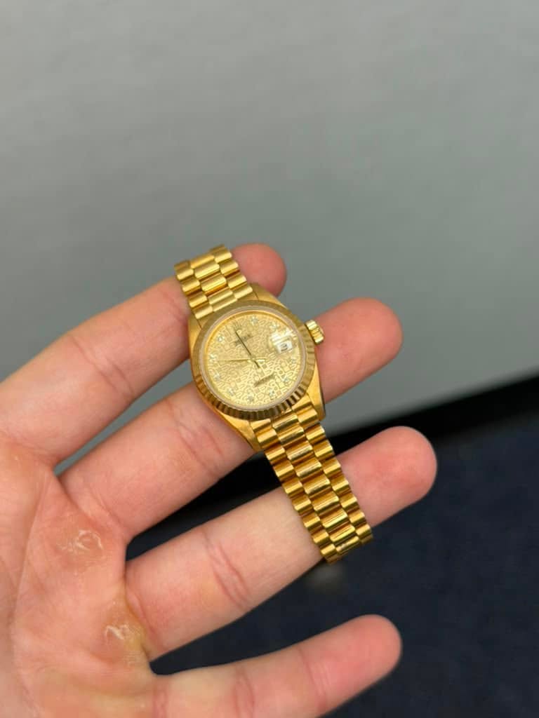 May be an image of wrist watch