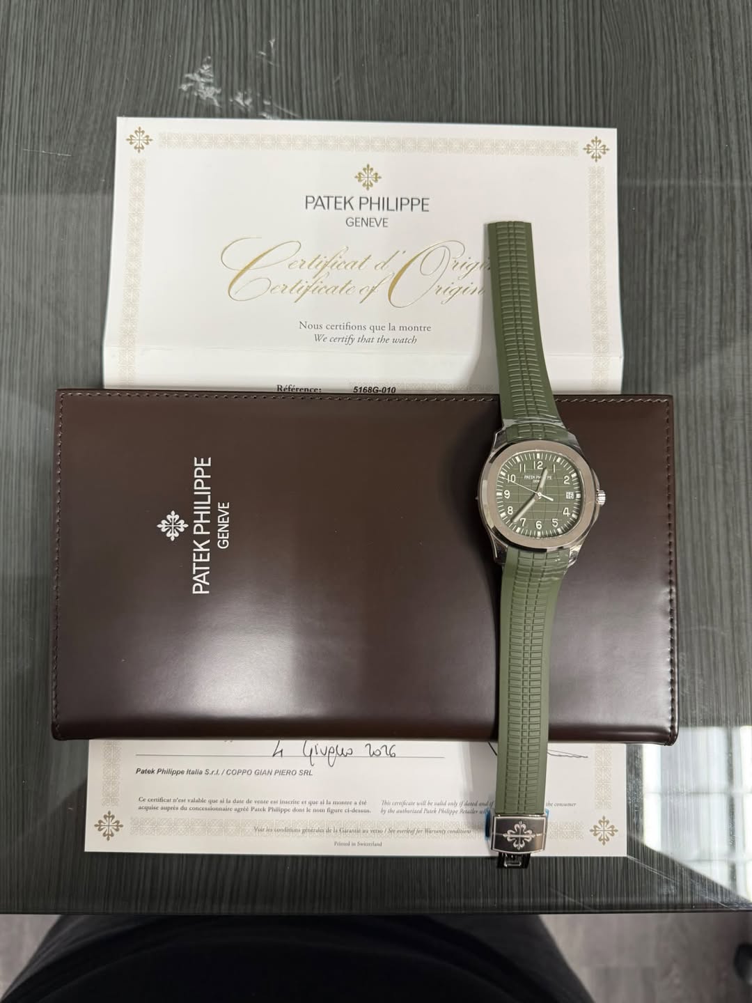 May be an image of saddle-stitched leather, wrist watch and text