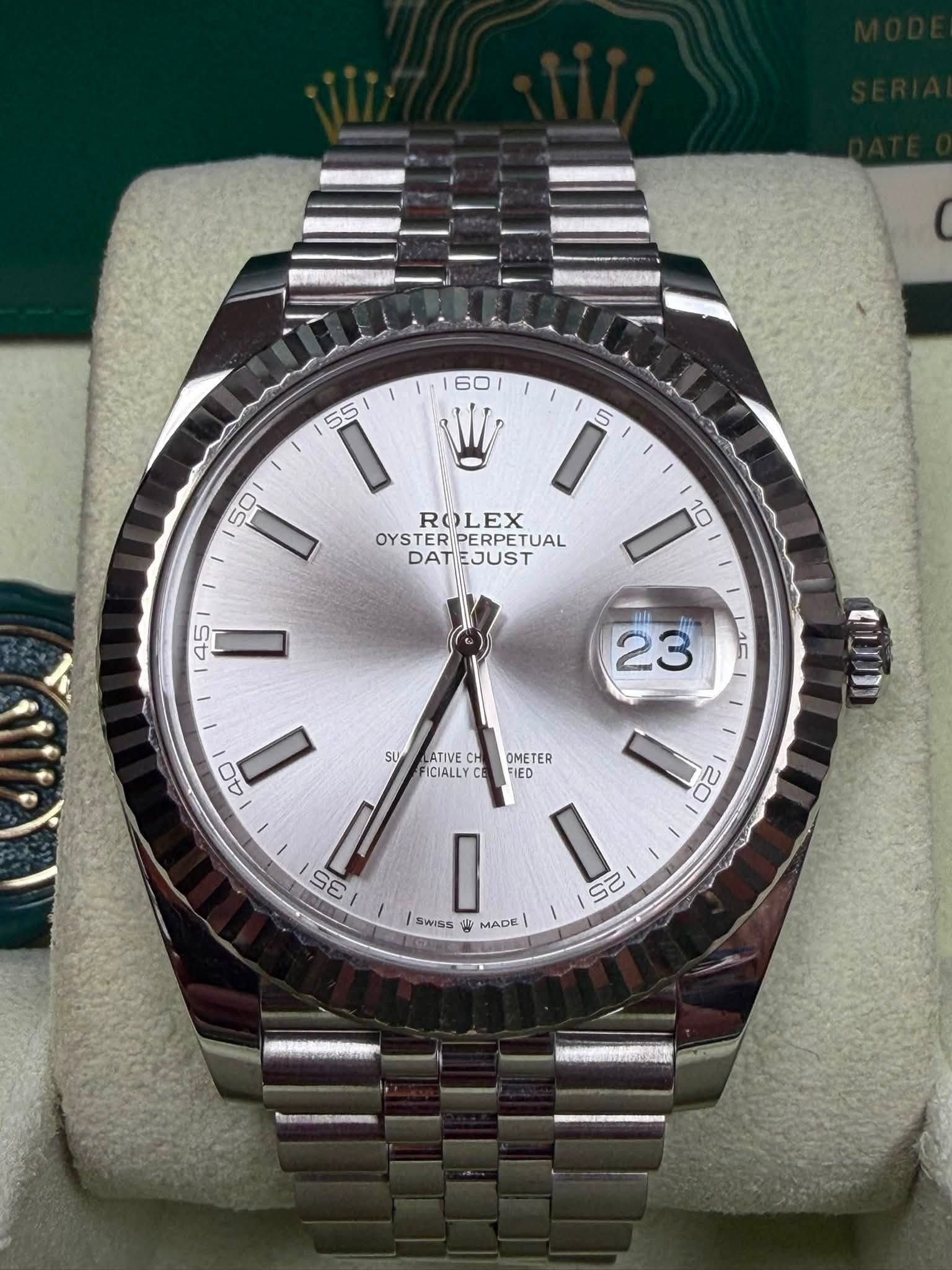 May be an image of wrist watch and text that says '- ROLEX OYSTER PERPETUAL TUAL DAT DATEJUST EJUST OMETER FIED QUD SU LATIVE FICIALLY CE M SE r mL I SwISS W MADE 20 23 لن'
