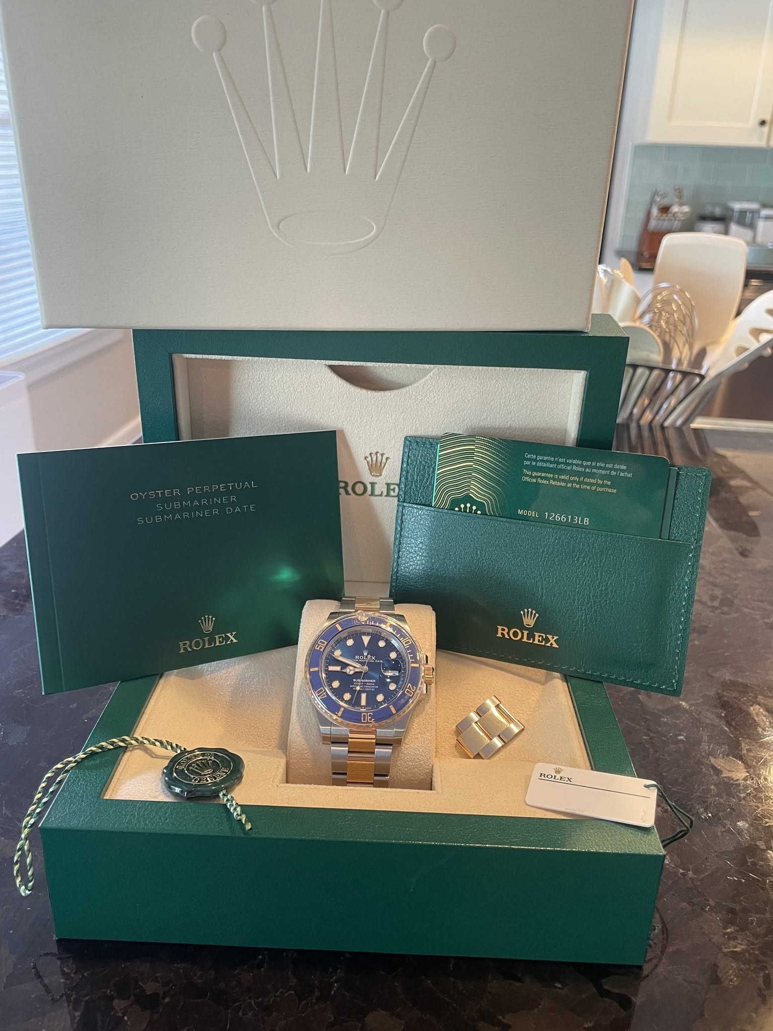 May be an image of wrist watch, napkin ring and text