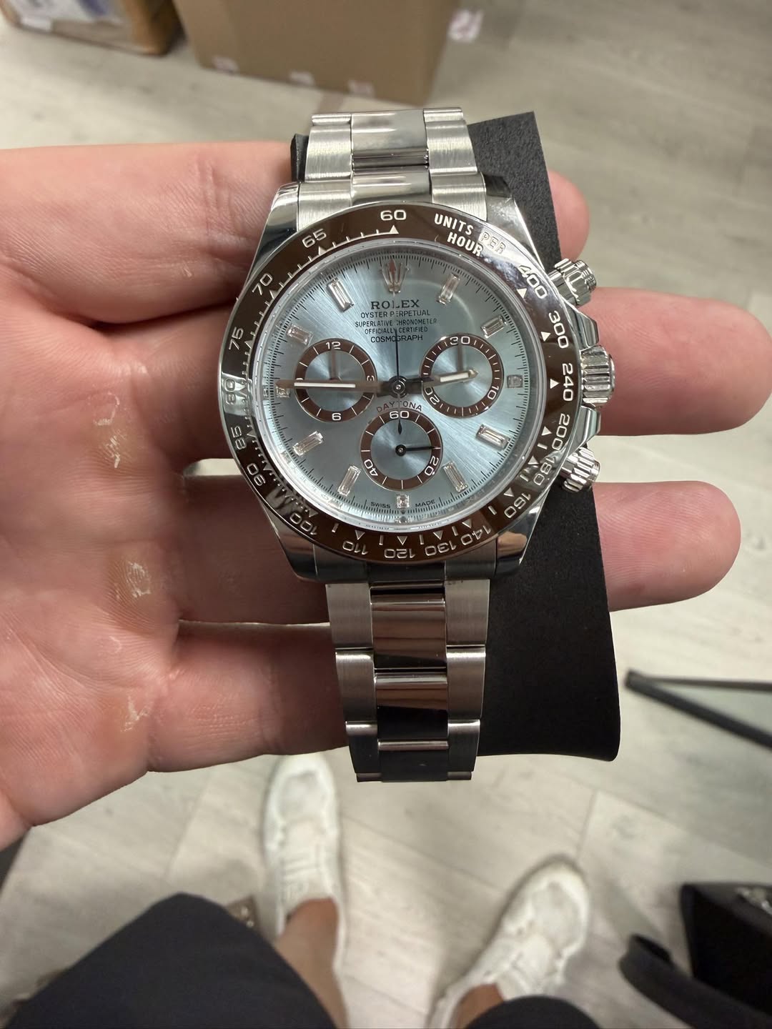 May be an image of wrist watch and text
