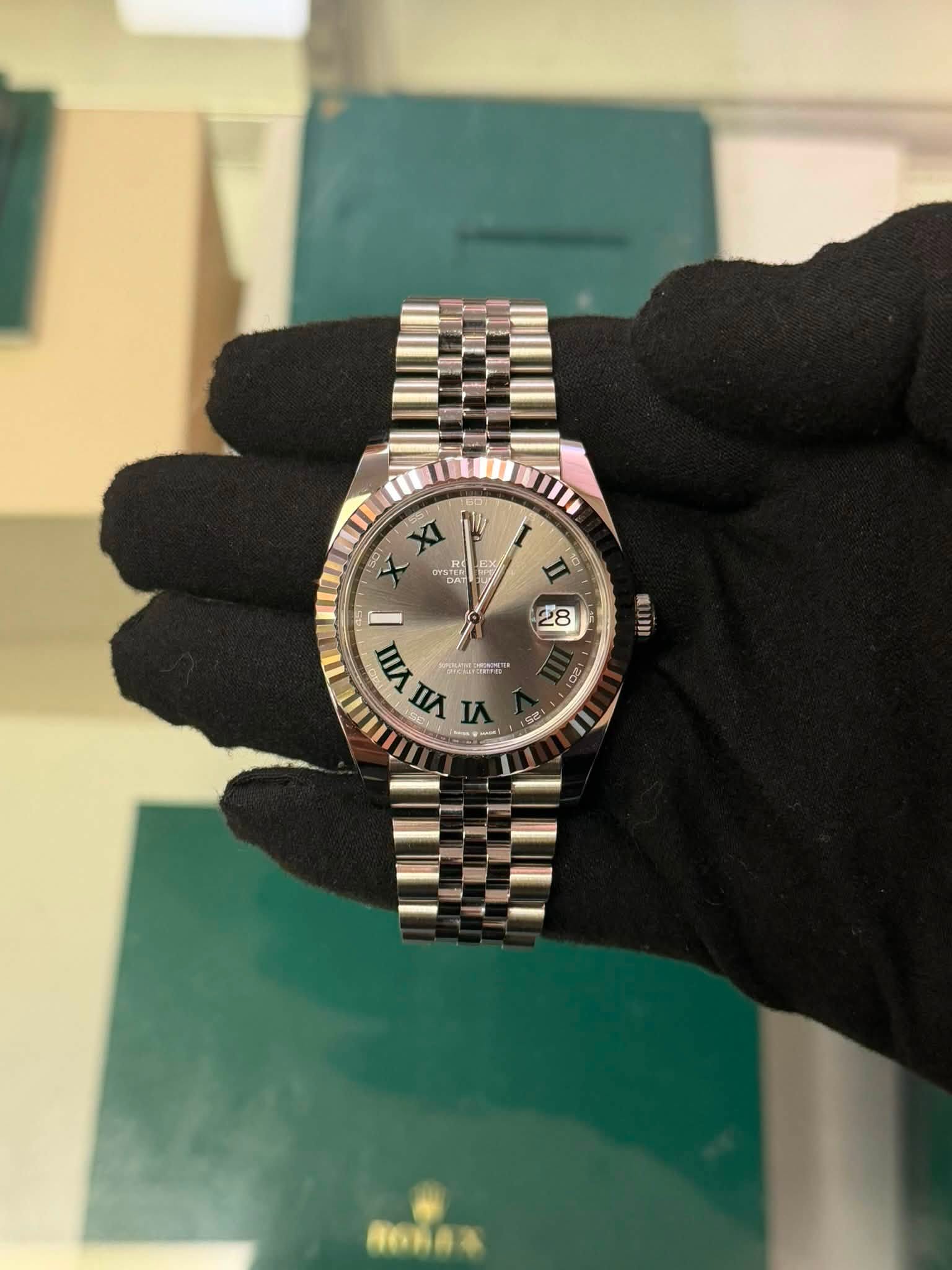 May be an image of wrist watch and text