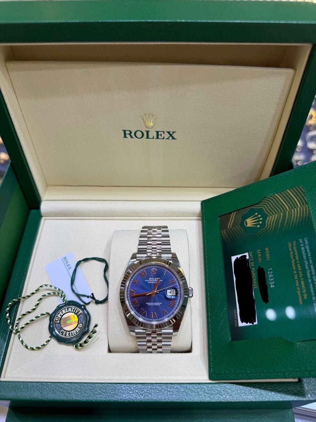 May be an image of wrist watch and text that says 'ROLEX ROLEX 16 ahn 밀어 AYERLATVE PERLATIVE CERTIFIE TIFIET 126334'