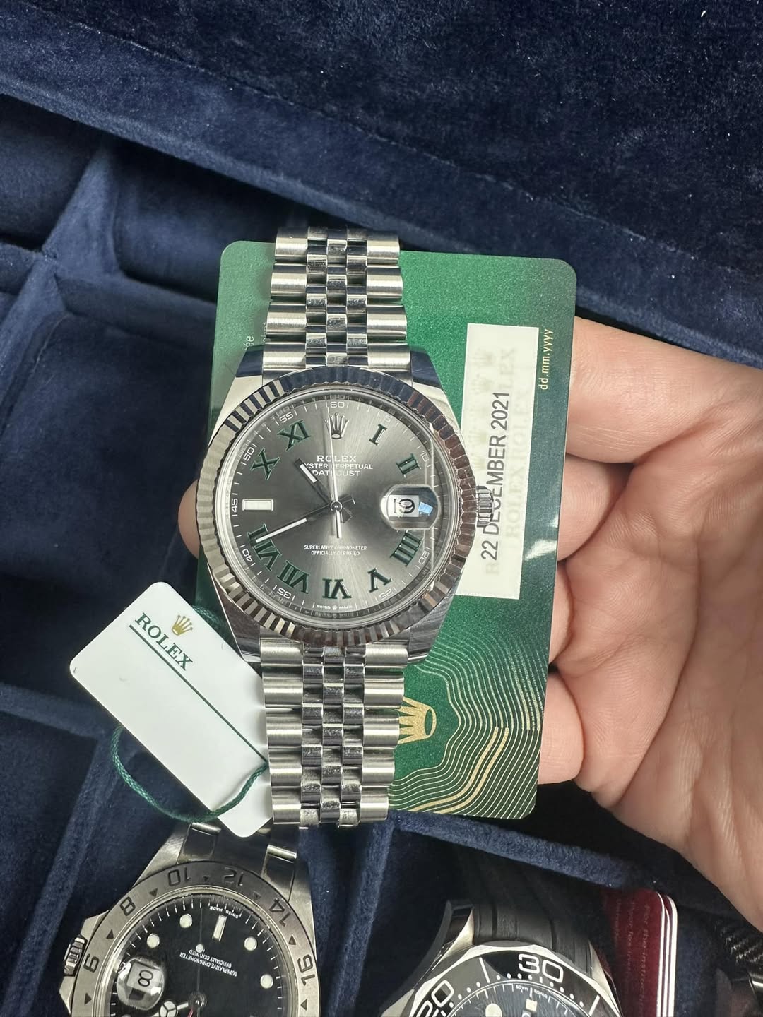 May be an image of wrist watch and text