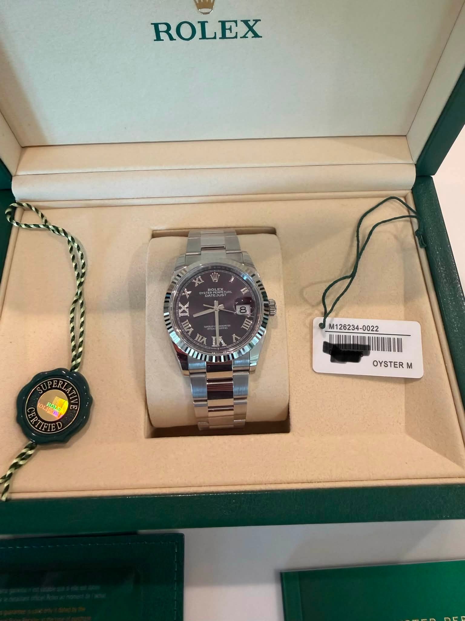 May be an image of wrist watch and text