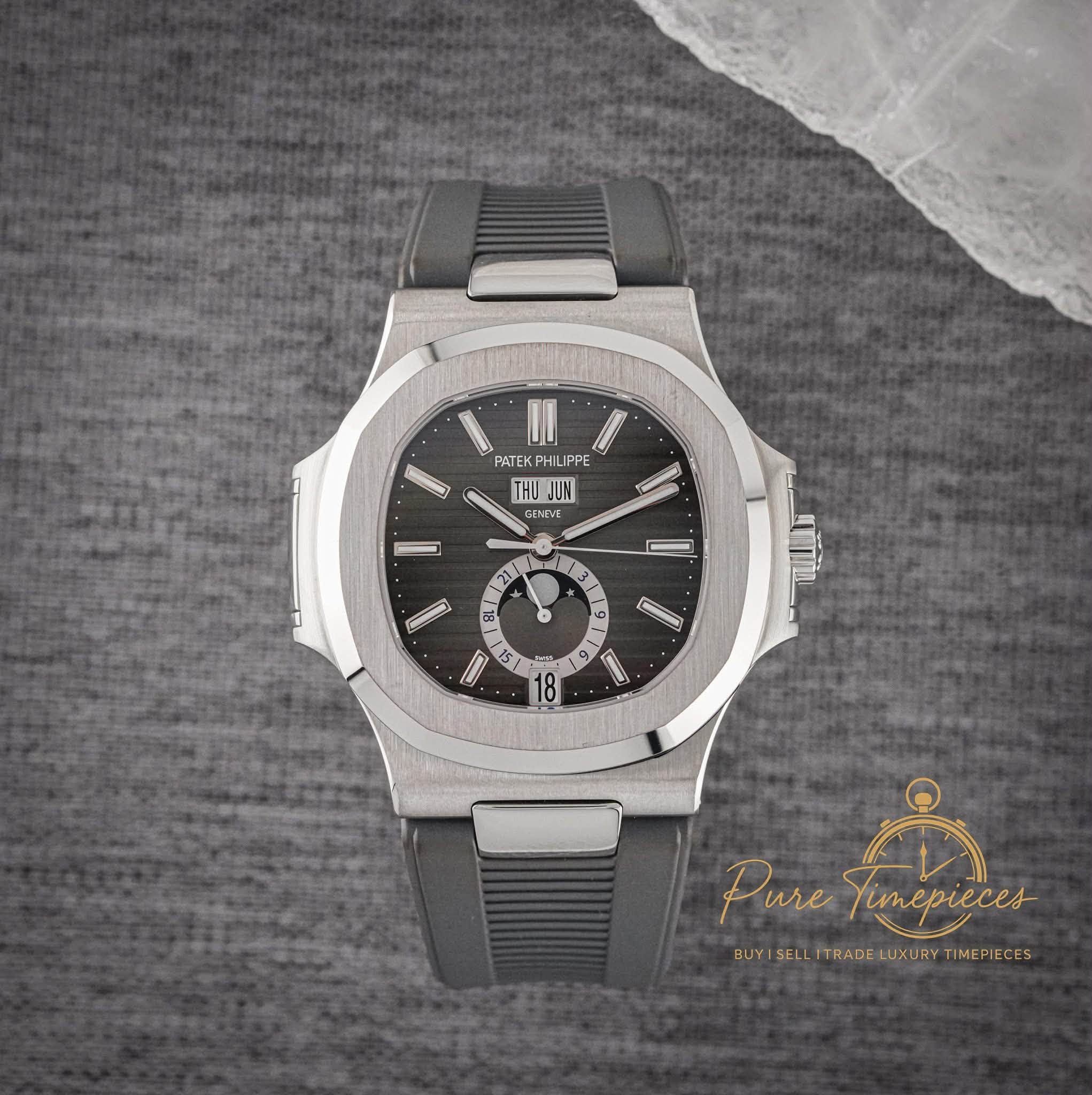 May be an image of wrist watch and text that says 'PATEK HIL HILIPP IPPE THU HUJUN GENEVE D BL 原工 0 57 ራ EI 6 1 18 Pure PureTunepieces ាំ imepieces BLYISELLİTRADELUKURYTIMEPIECES…