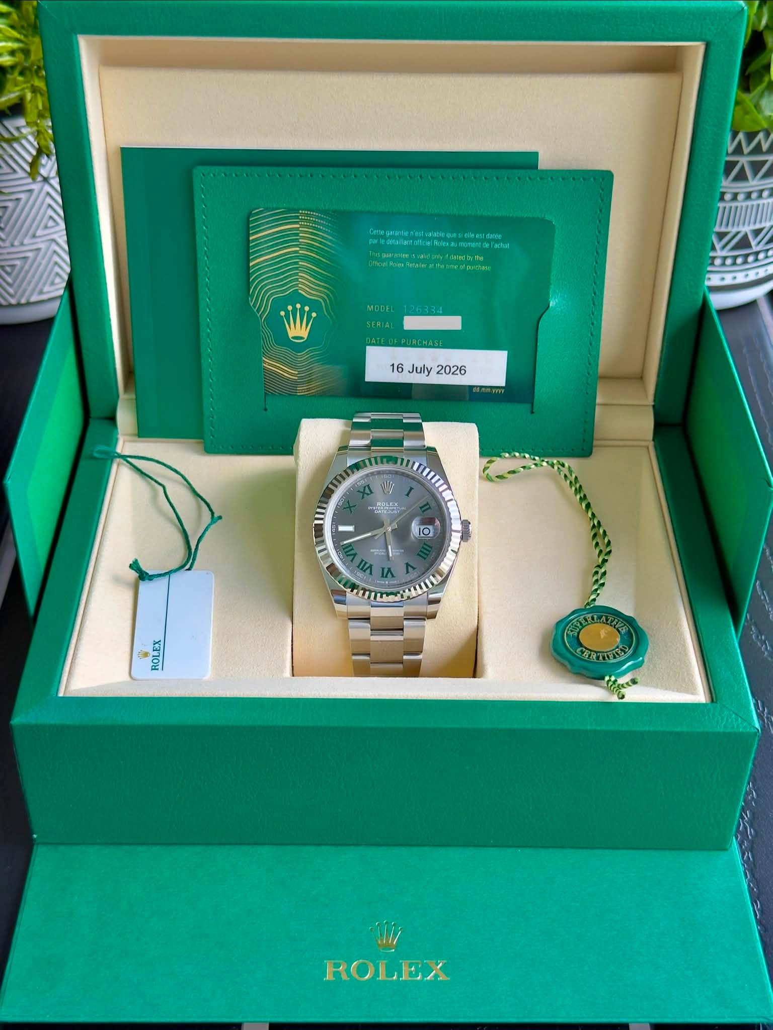 May be an image of wrist watch and text