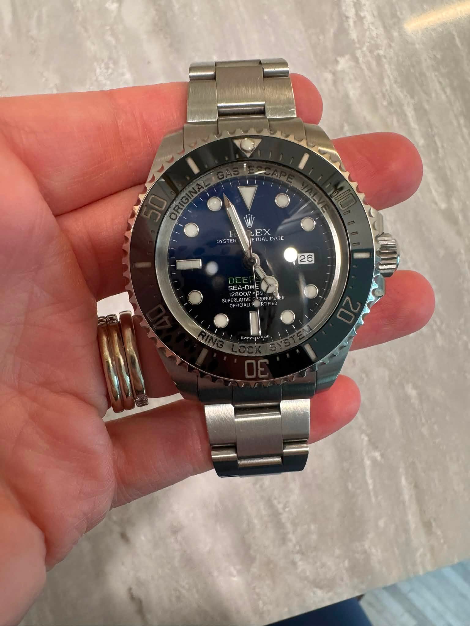 May be an image of wrist watch and text that says 'EX DATE 26'