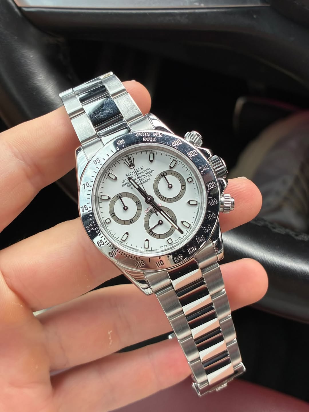 May be an image of wrist watch and text