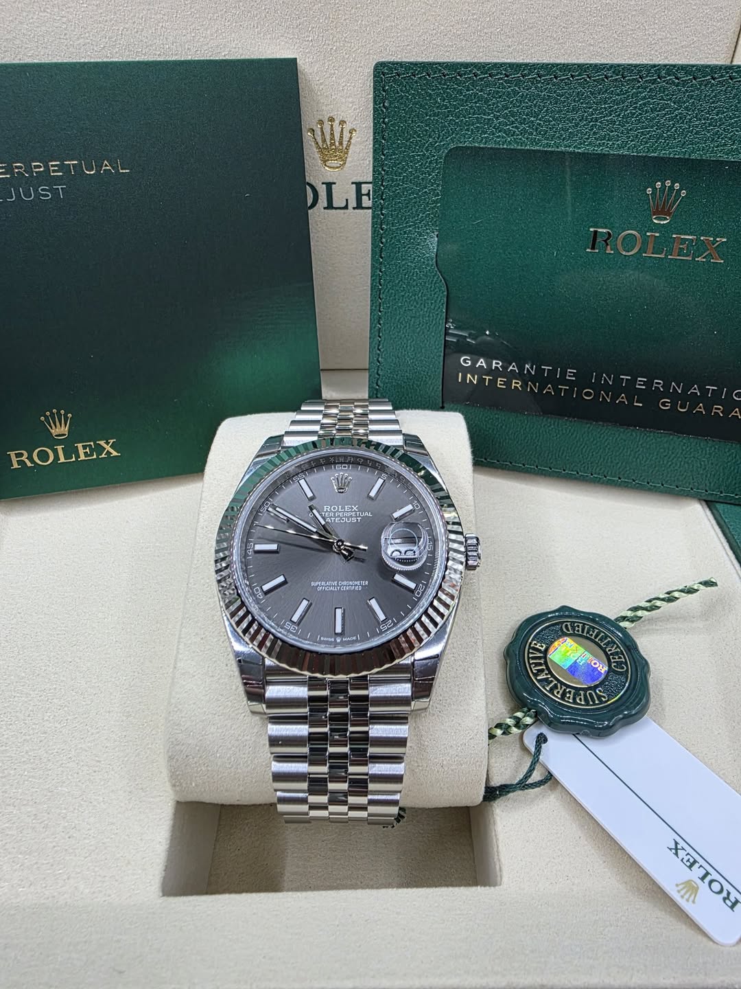 May be an image of wrist watch and text