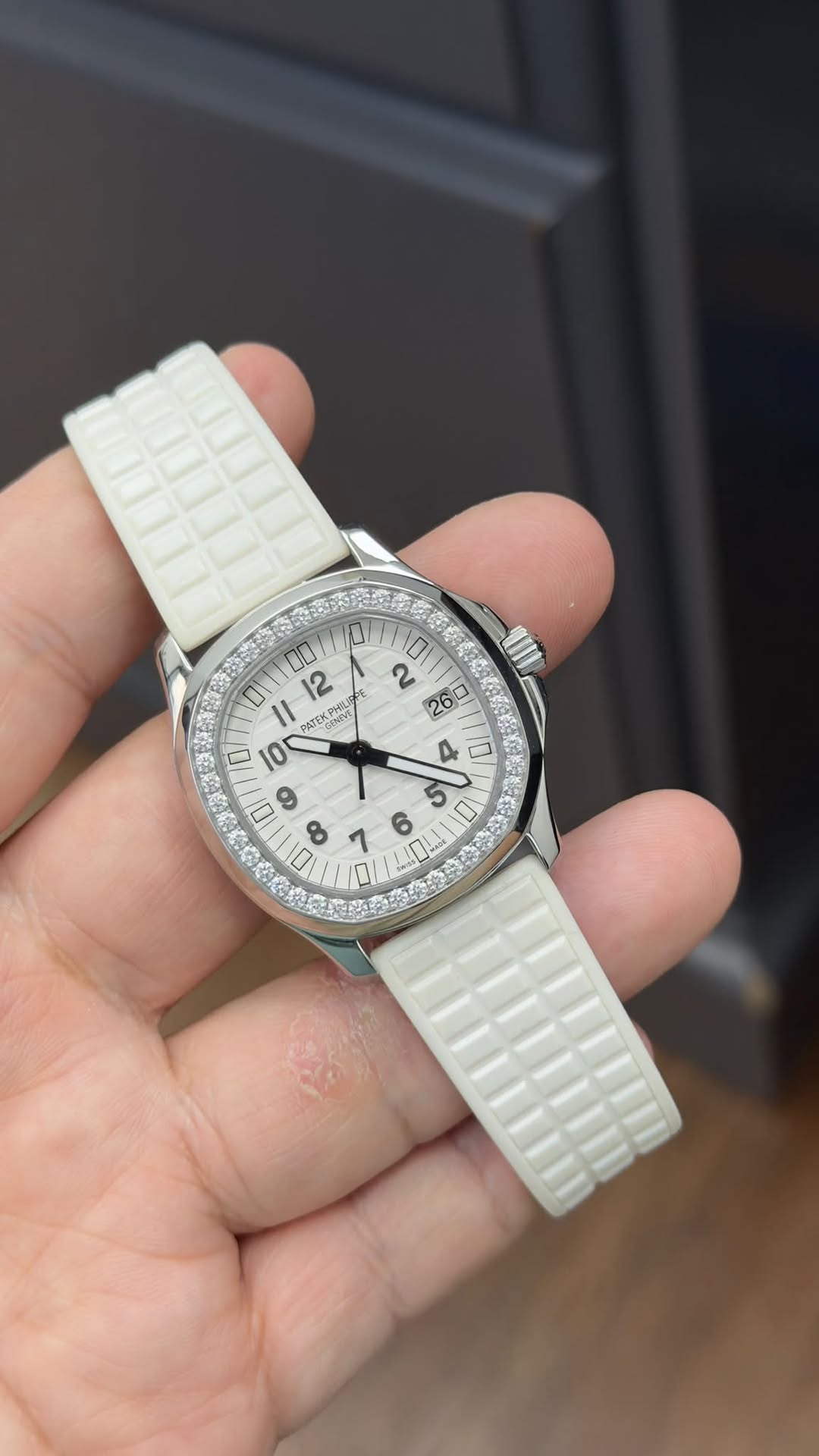 May be an image of wrist watch and text