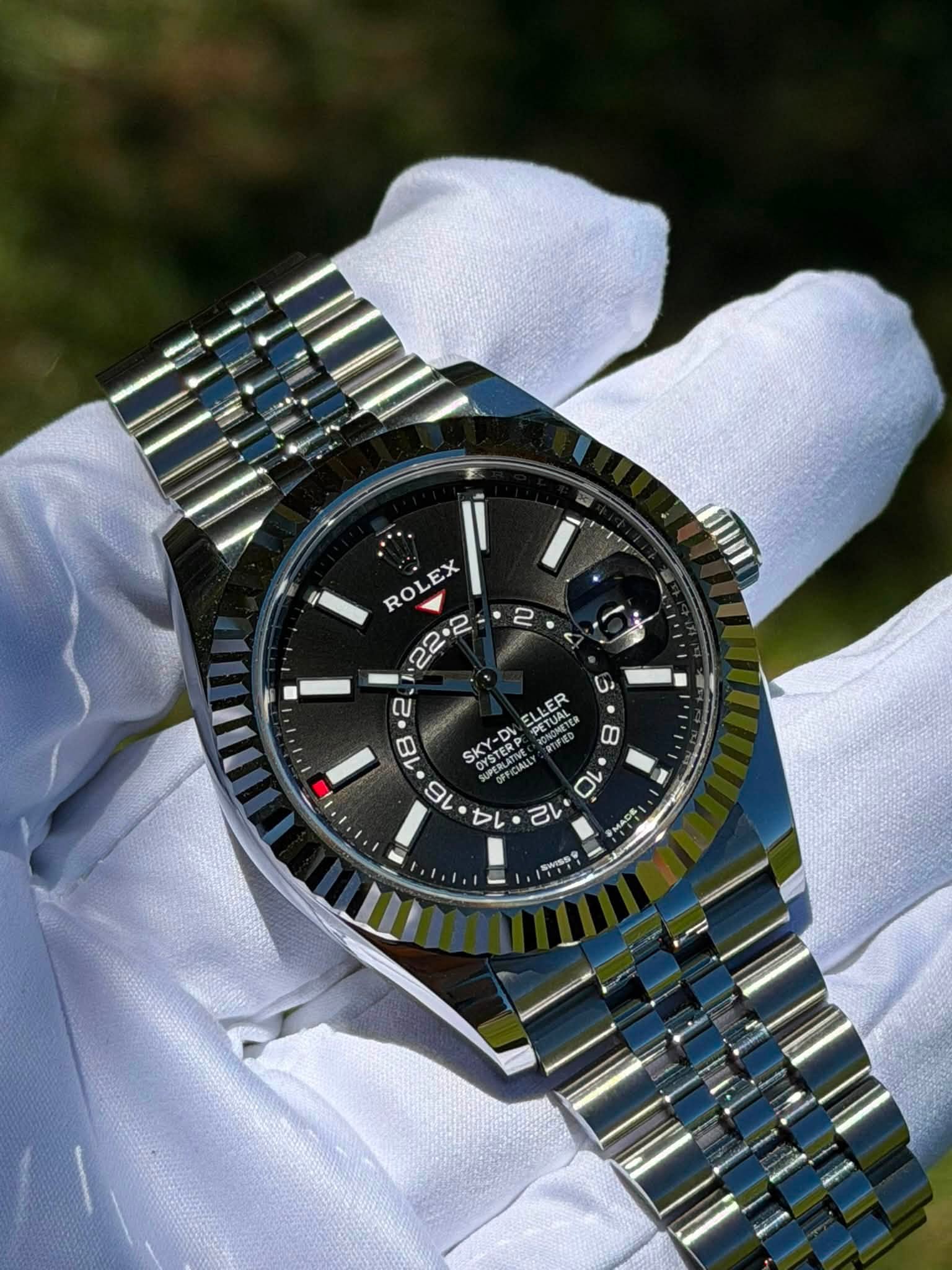 May be an image of wrist watch and text