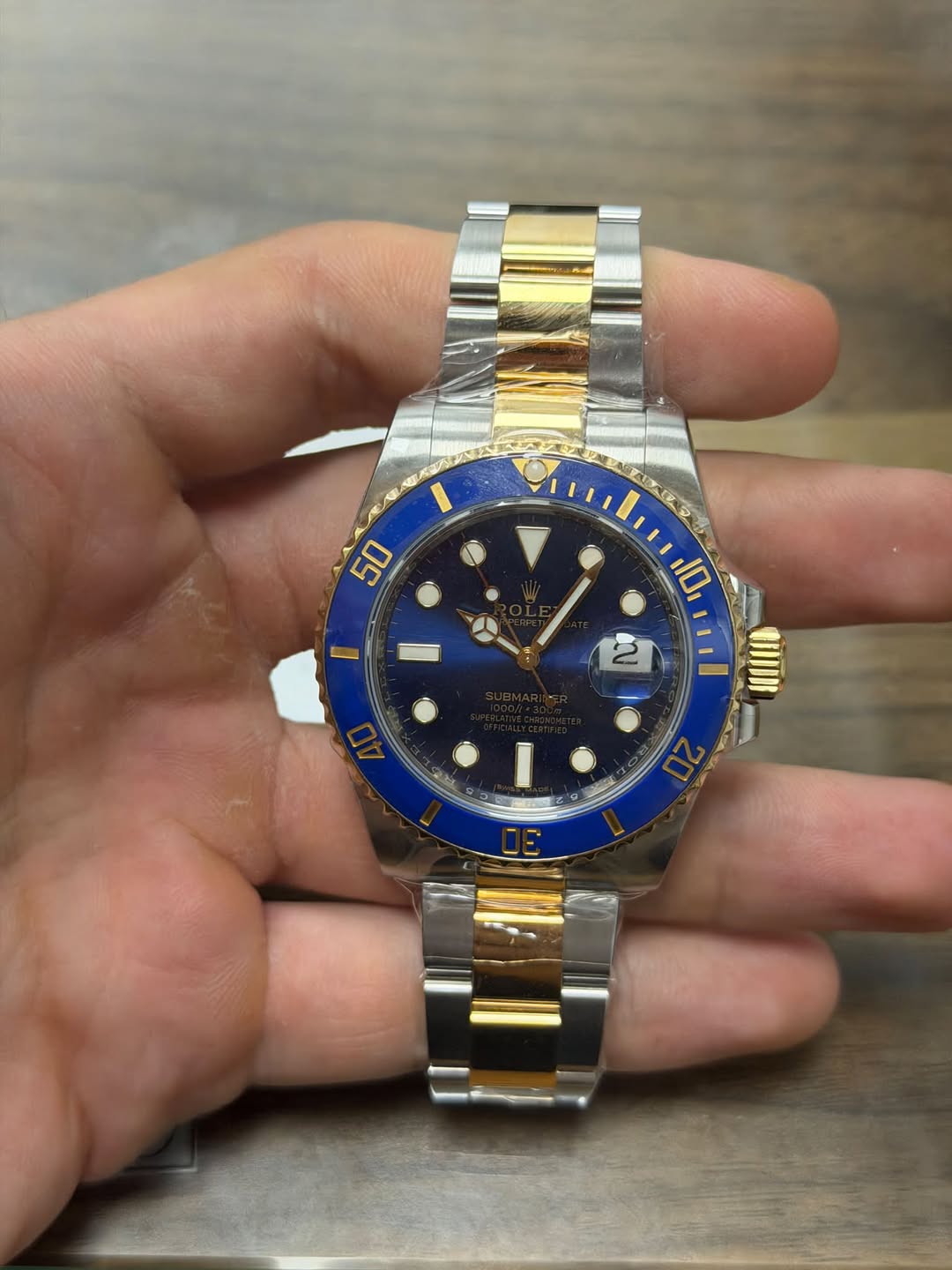 May be an image of wrist watch and text