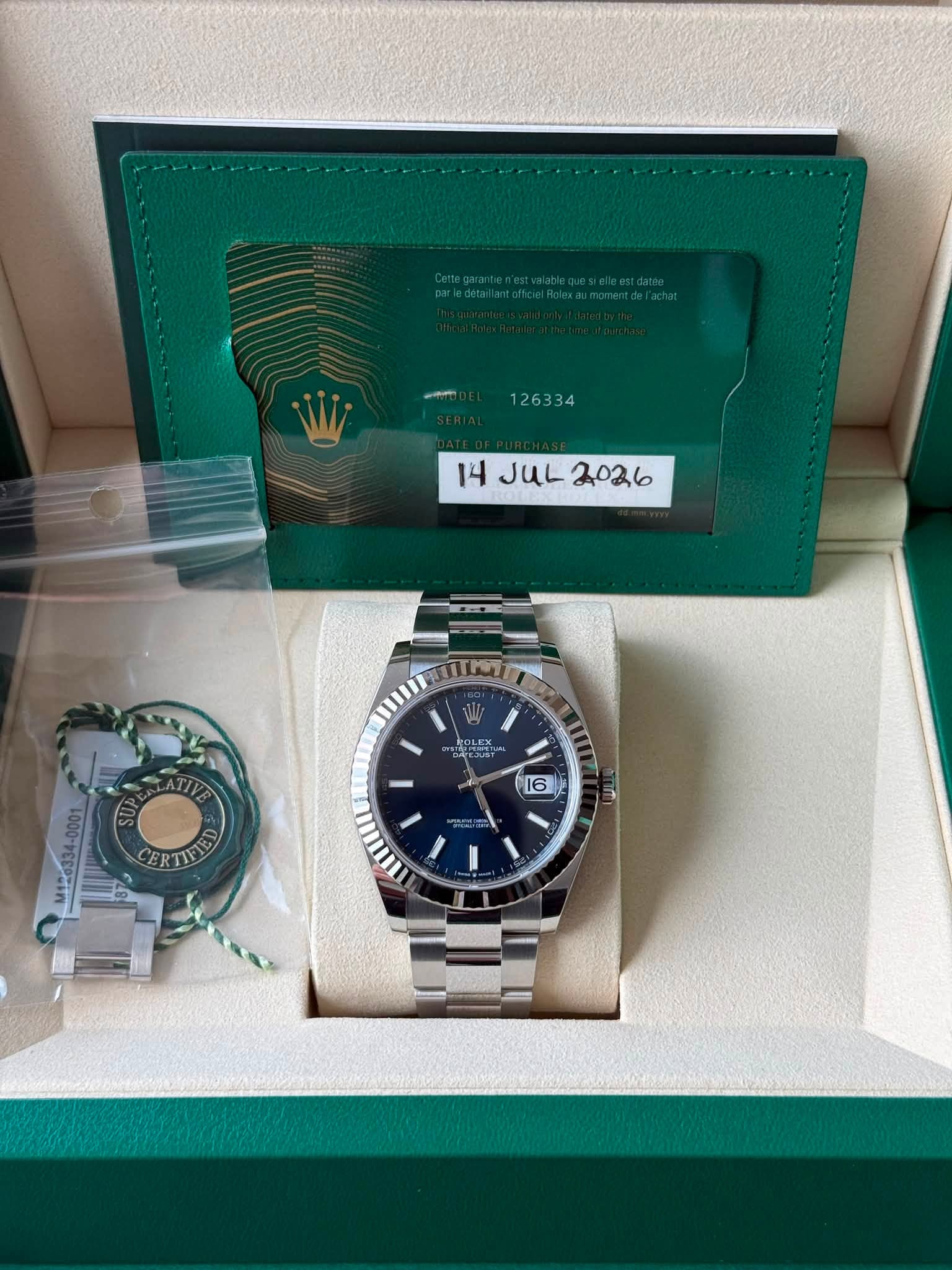 May be an image of wrist watch and text that says ' JUL 4JUL2026 2026 OLEX I 16 CERTIIE TT ED'
