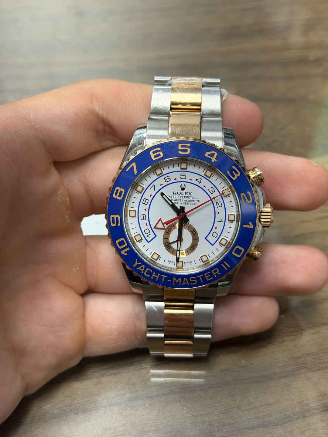 May be an image of wrist watch and text