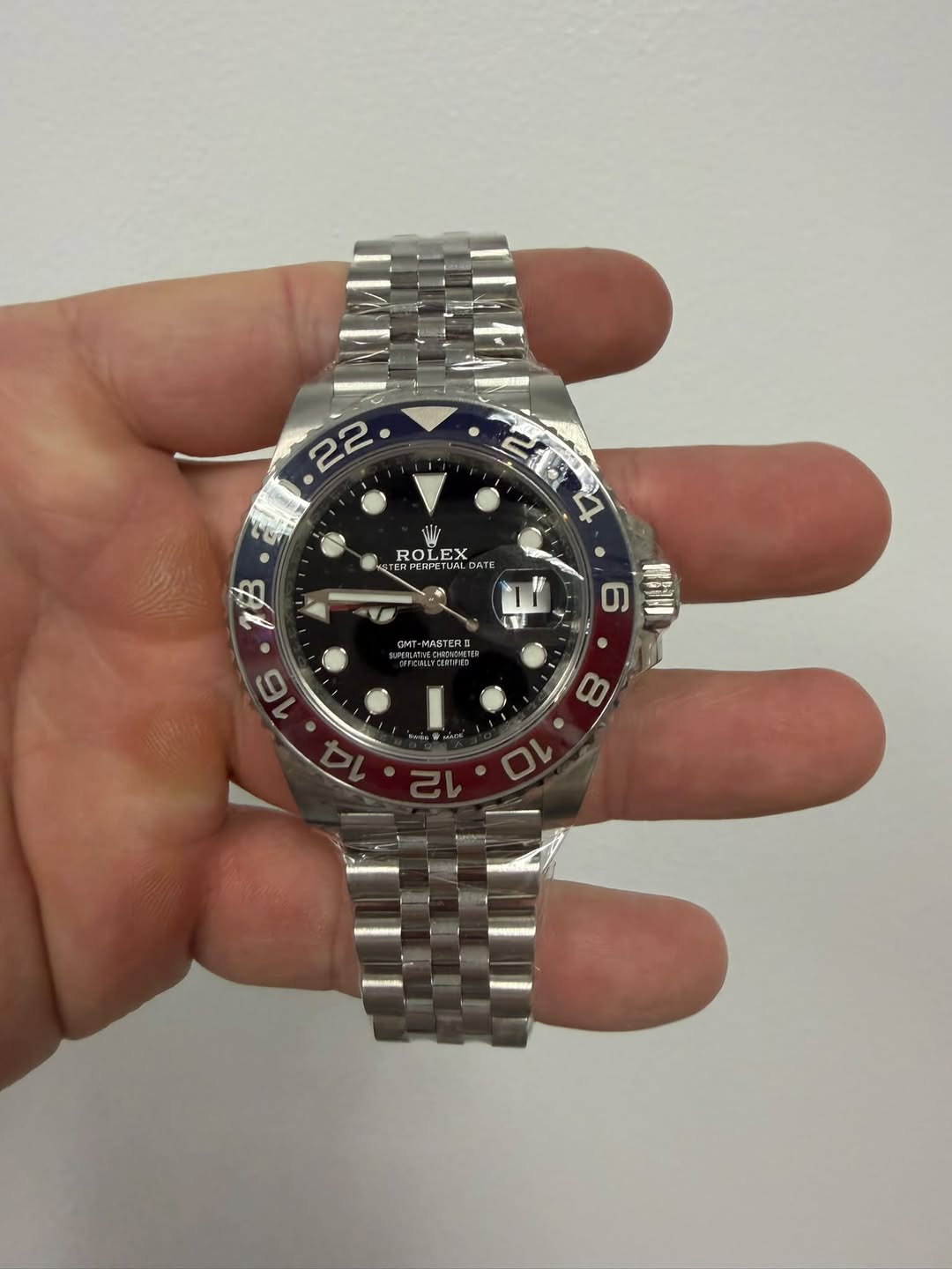 May be an image of wrist watch and text