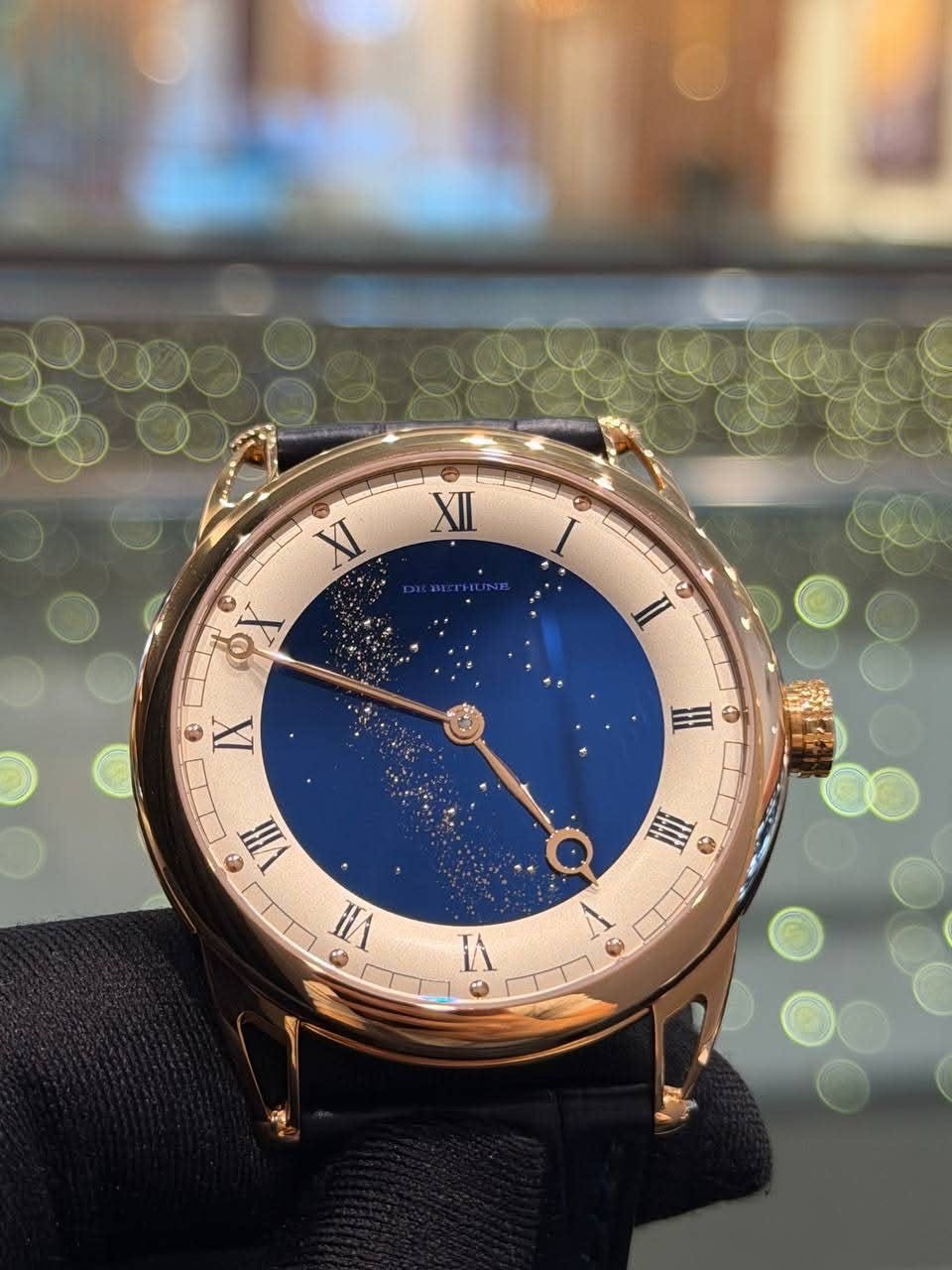 May be an image of wrist watch and text that says 'XII XI I II ه IX H Ⅲ G VII HA 三 7ግዝ1 I A'