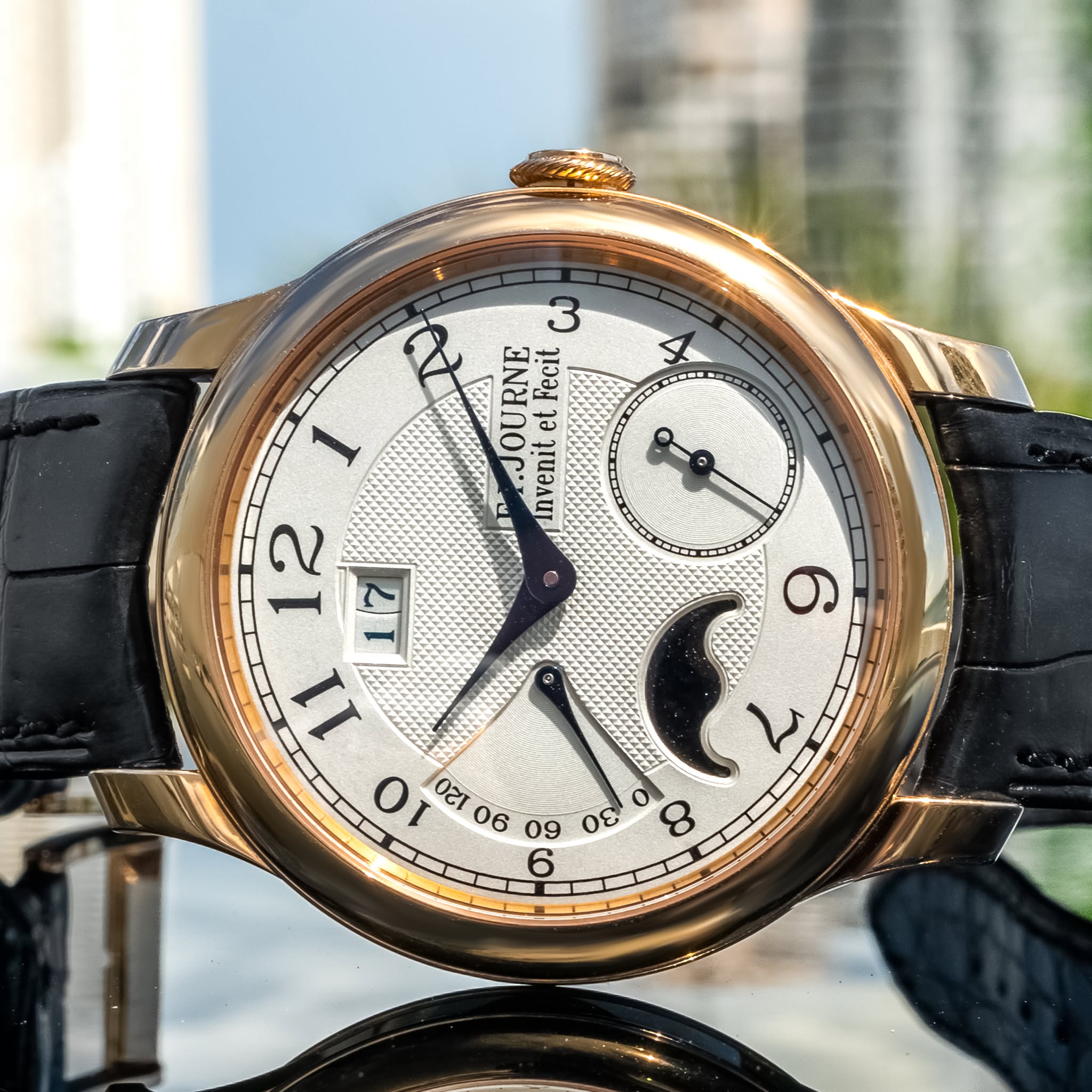 May be an image of wrist watch and text that says '4 ω RAJOURNE OU et RNE Fecit nven Invenit i ム o Or 22 හ O ိ 06 09 όε 6'