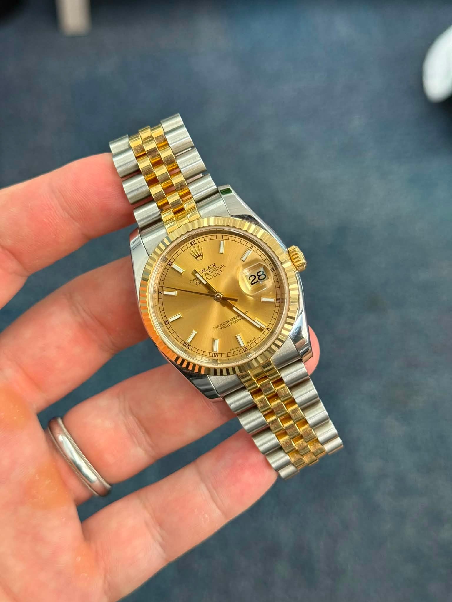 May be an image of wrist watch and text