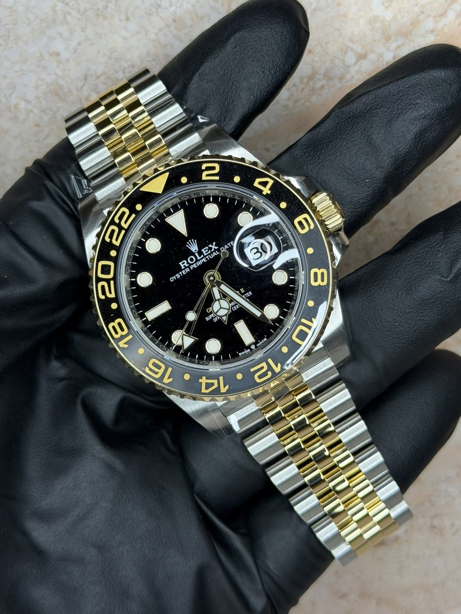 May be an image of wrist watch and text