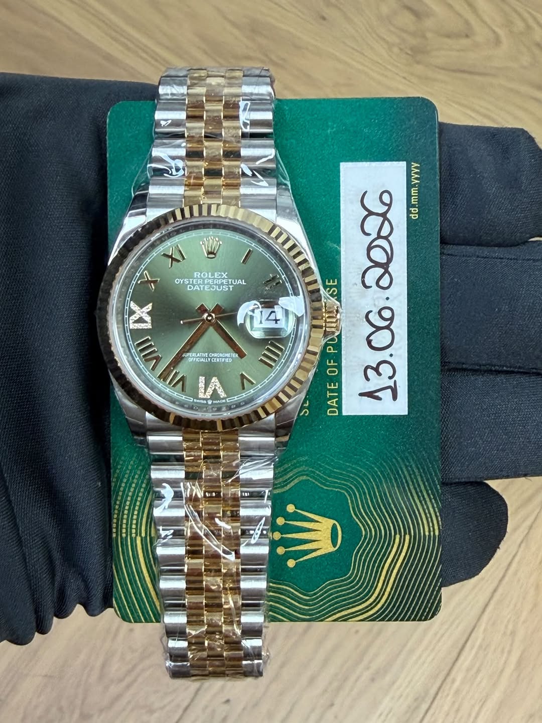 May be an image of wrist watch and text