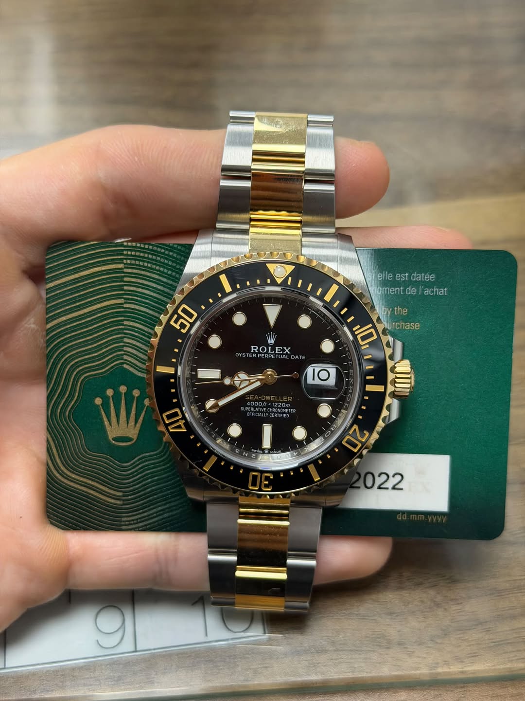 May be an image of wrist watch and text