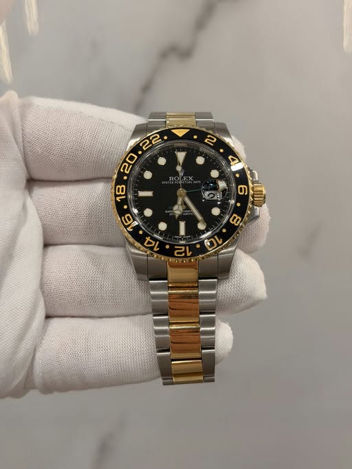 May be an image of wrist watch and text