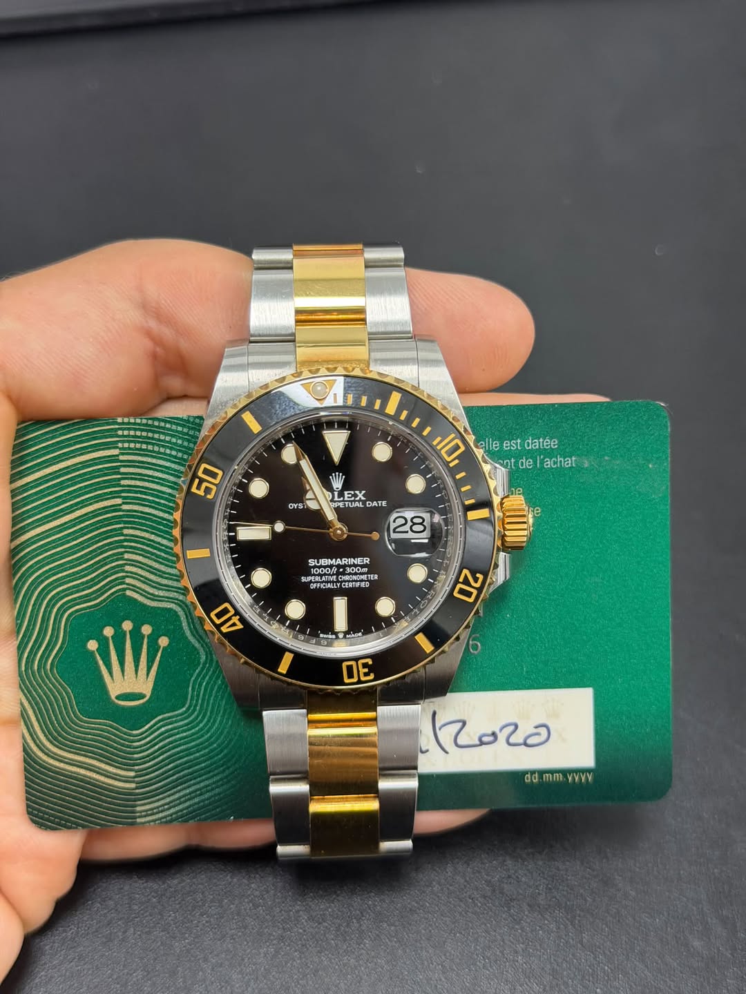 May be an image of wrist watch and text