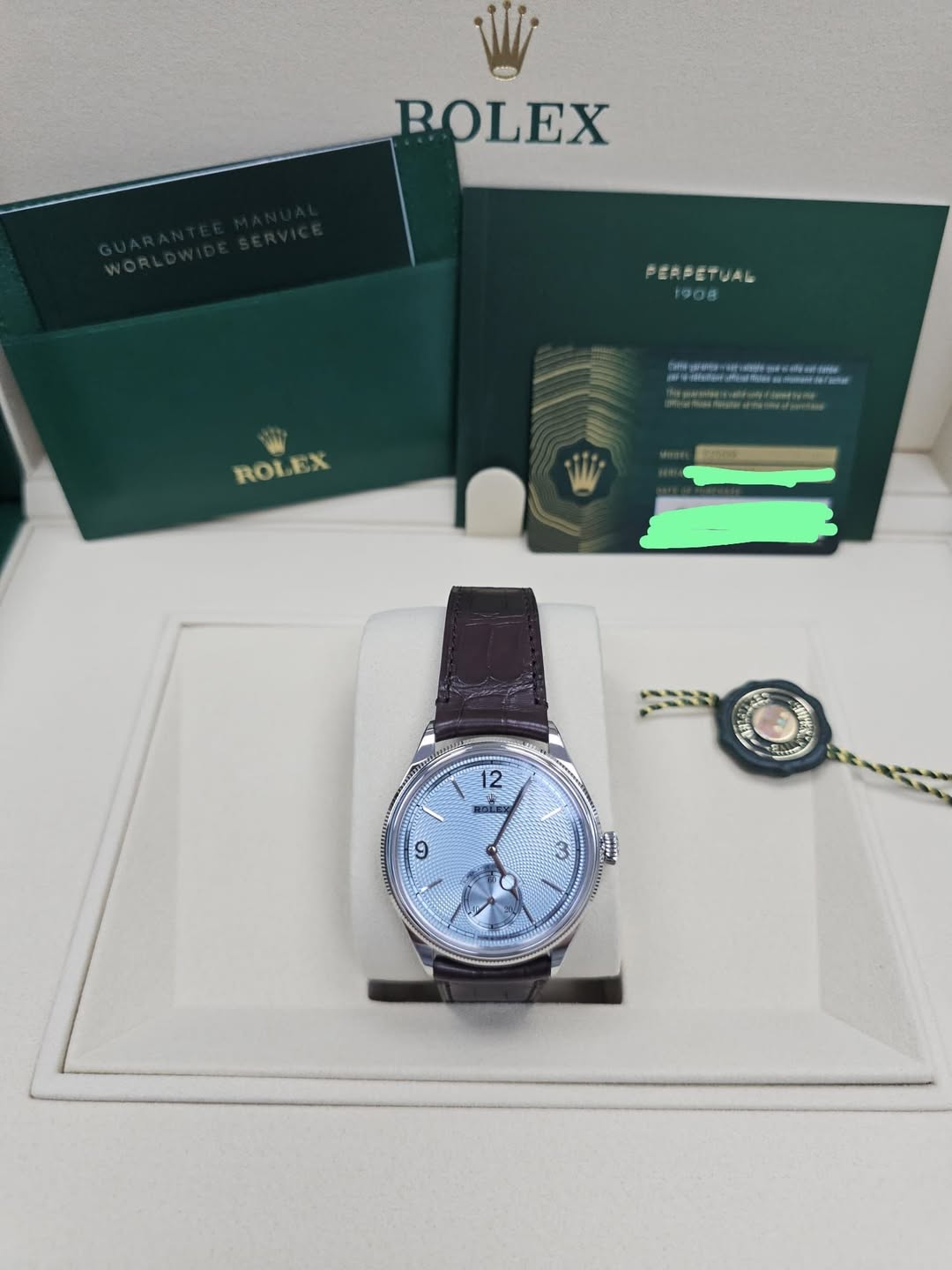 May be an image of wrist watch and text