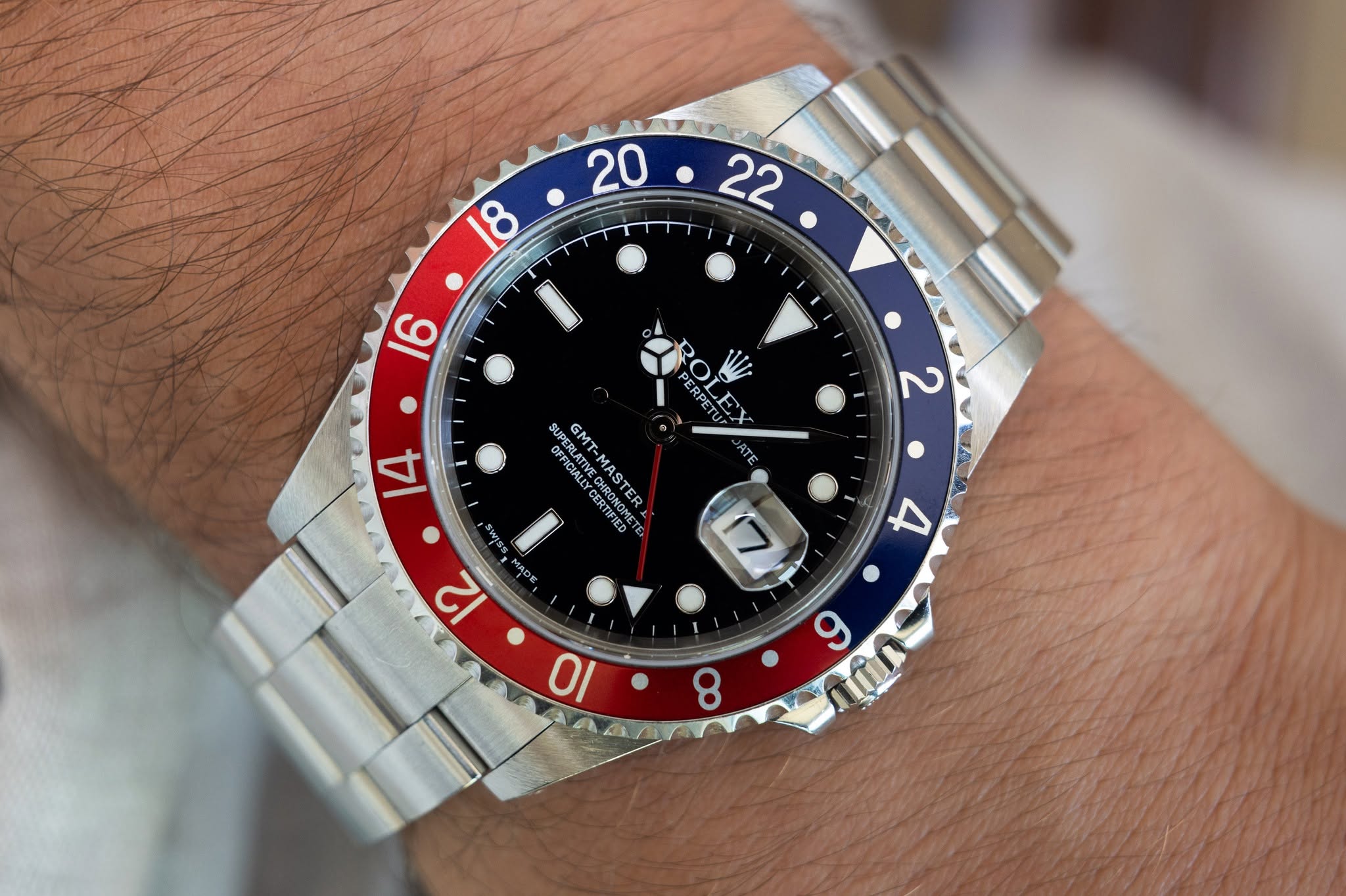 May be an image of wrist watch and text