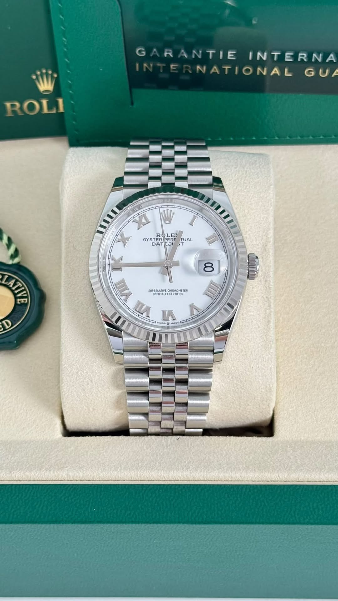 May be an image of wrist watch and text
