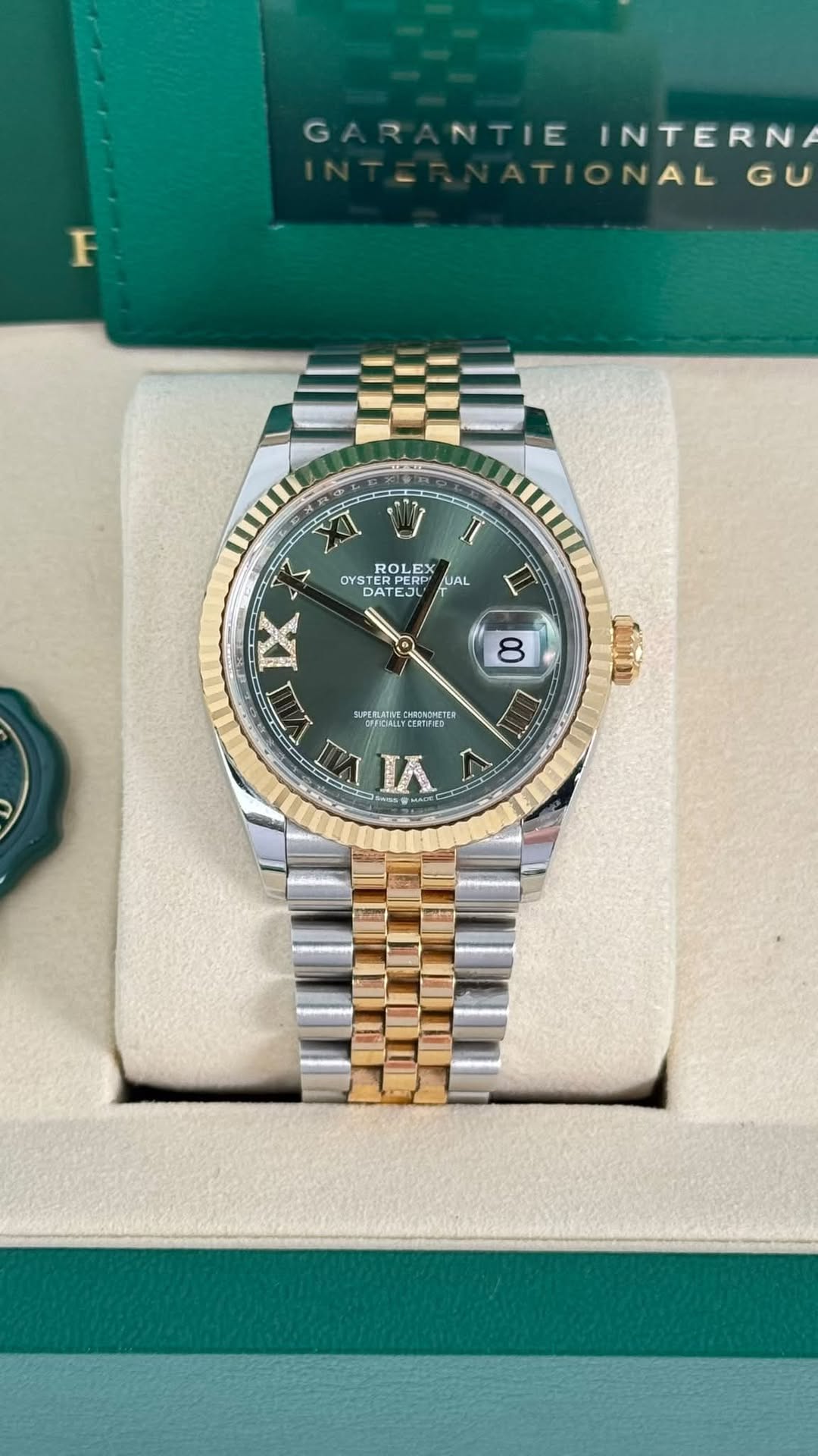 May be an image of wrist watch and text