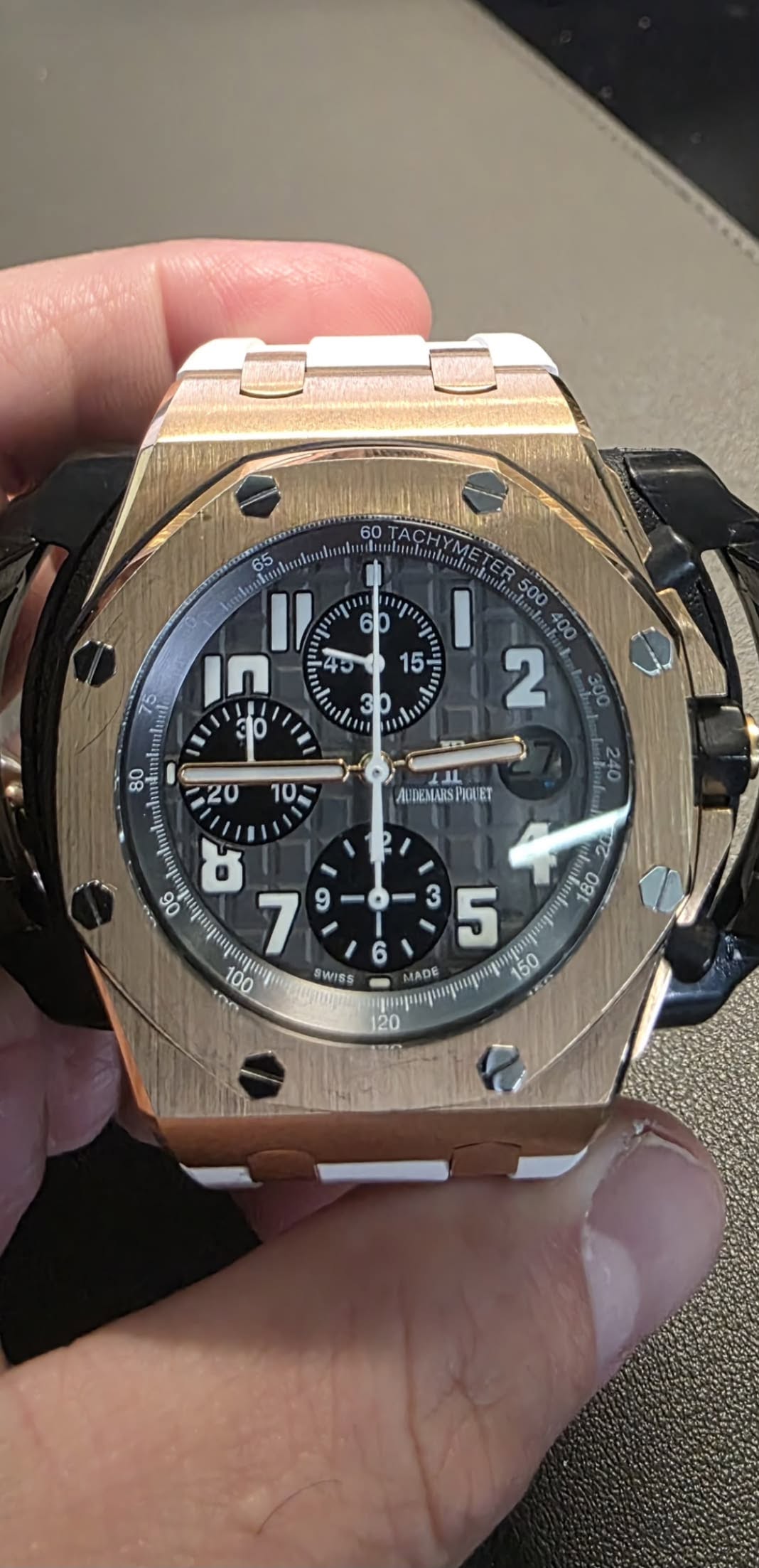 May be an image of wrist watch and text
